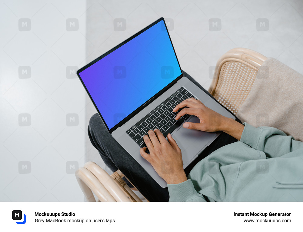 Grey MacBook mockup on user’s laps