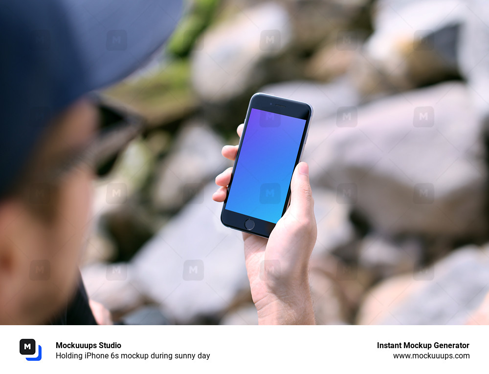 Holding iPhone 6s mockup during sunny day