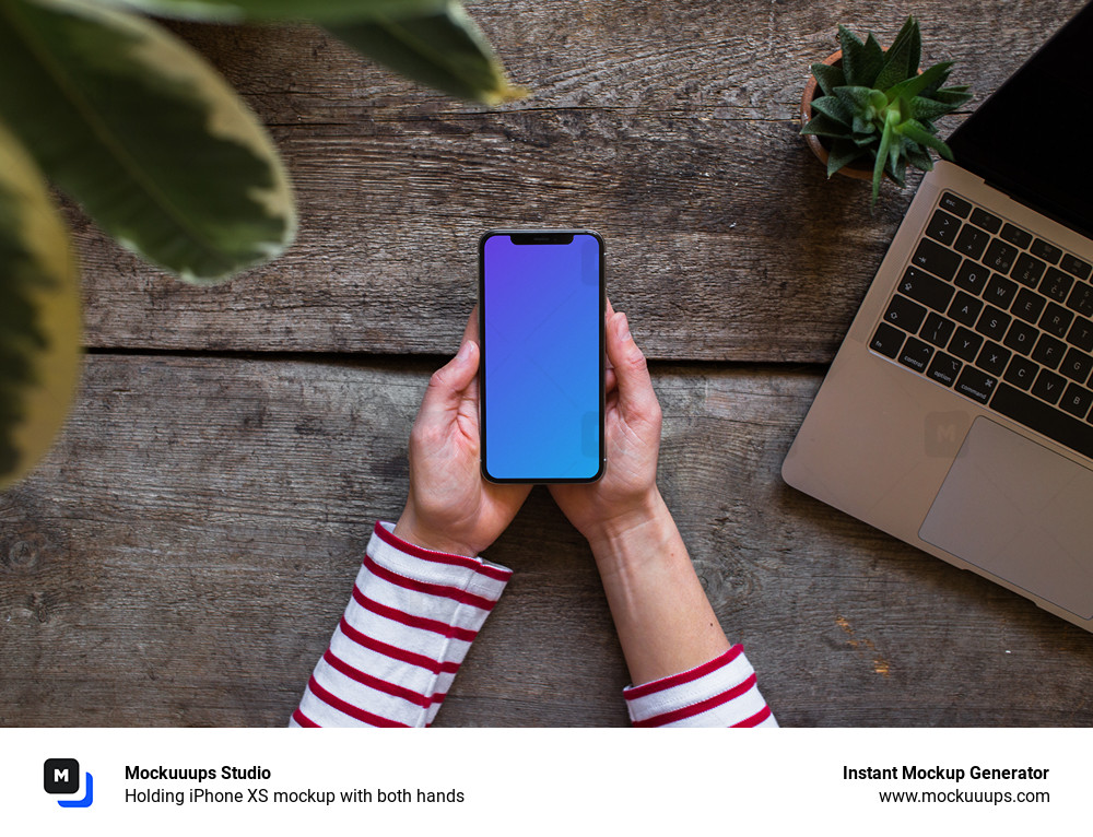 Holding iPhone XS mockup with both hands