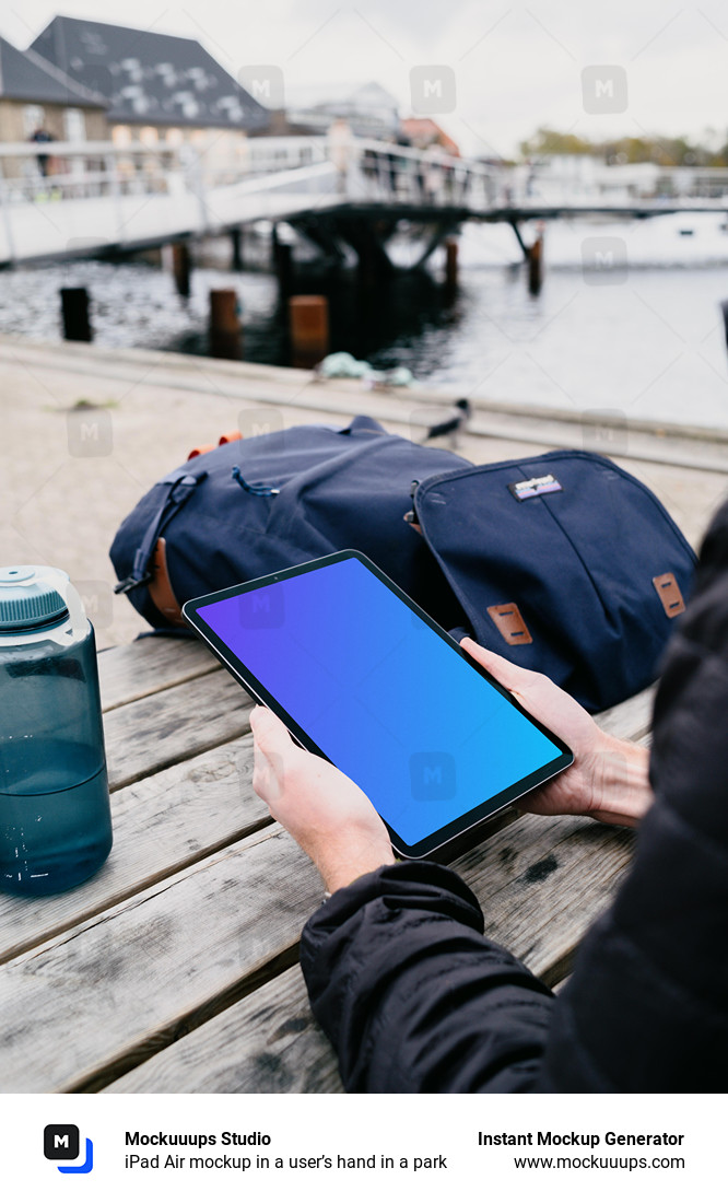 iPad Air mockup in a user’s hand in a park