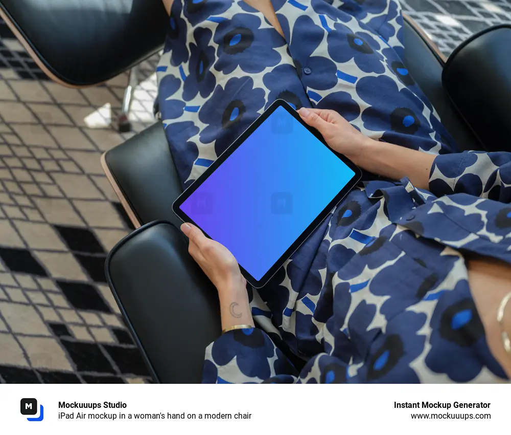 iPad Air mockup in a woman's hand on a modern chair