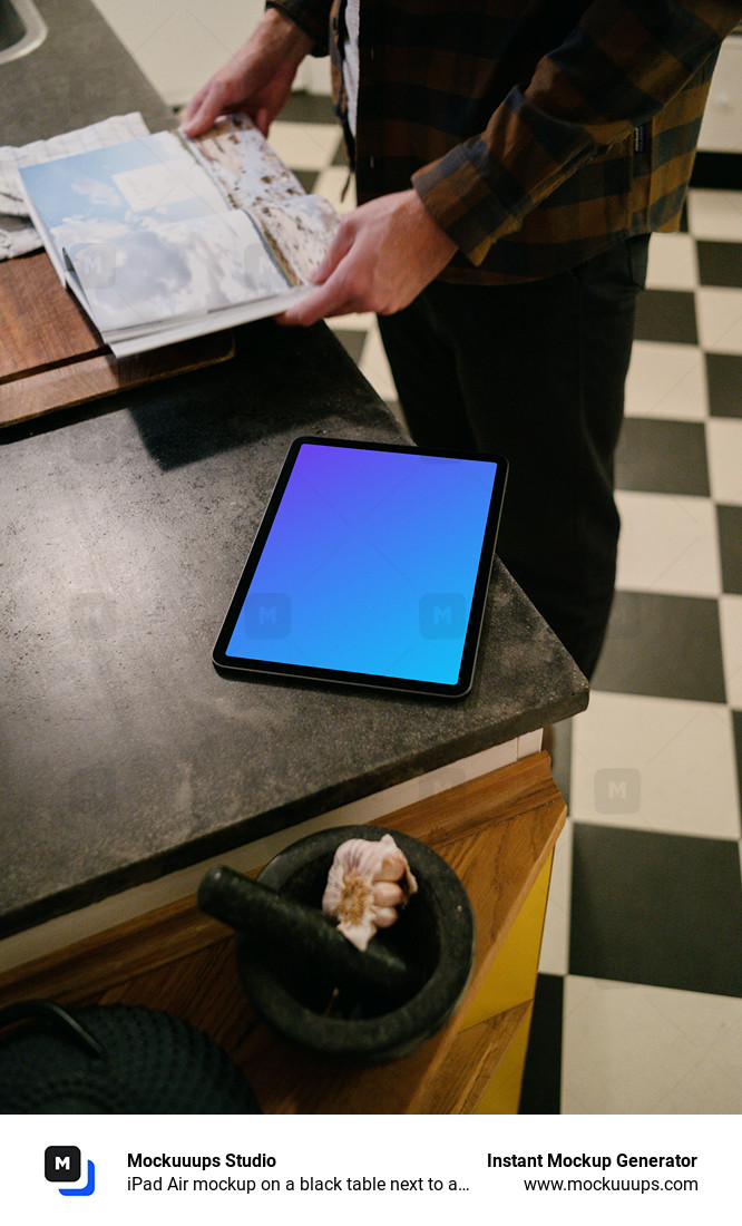 iPad Air mockup on a black table next to a user