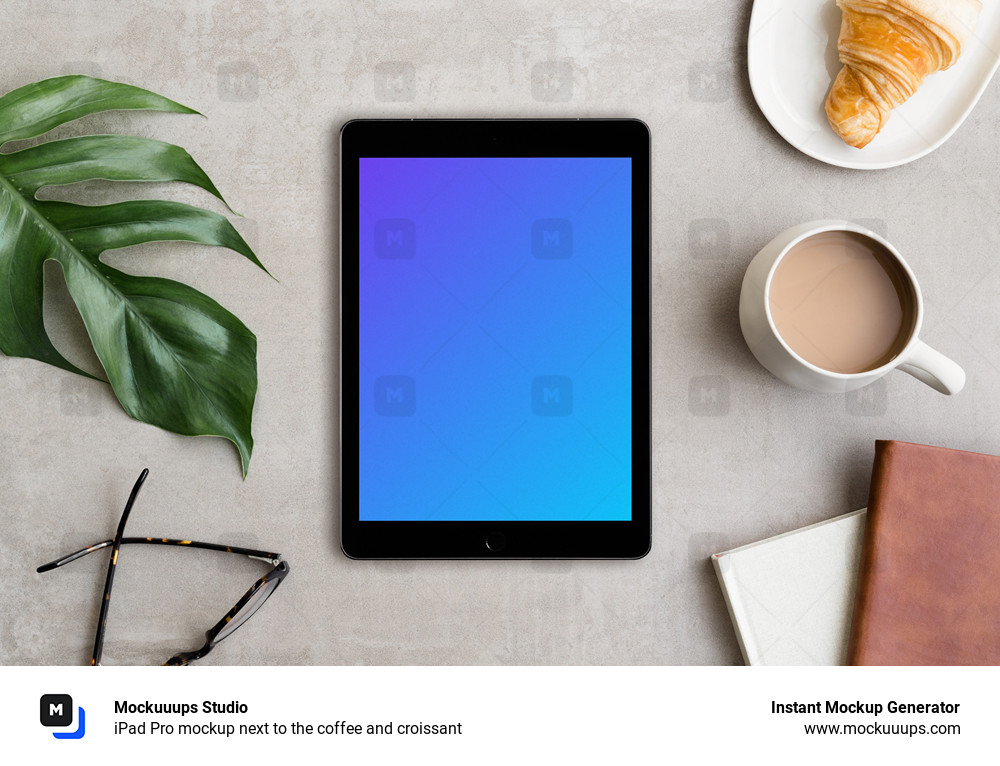 iPad Pro mockup next to the coffee and croissant