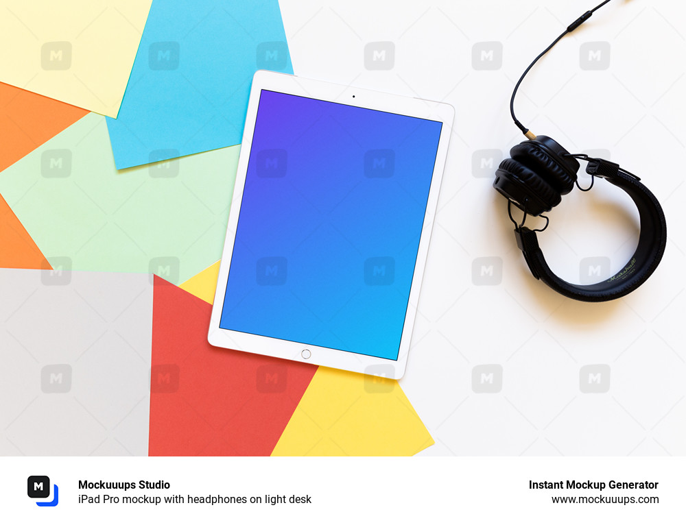 iPad Pro mockup with headphones on light desk