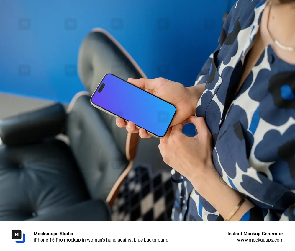 iPhone 15 Pro mockup in woman's hand against blue background