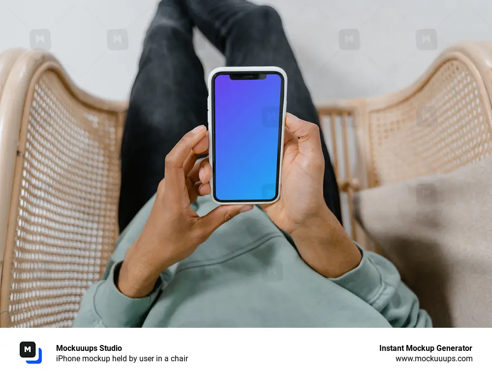 iPhone mockup held by user in a chair 