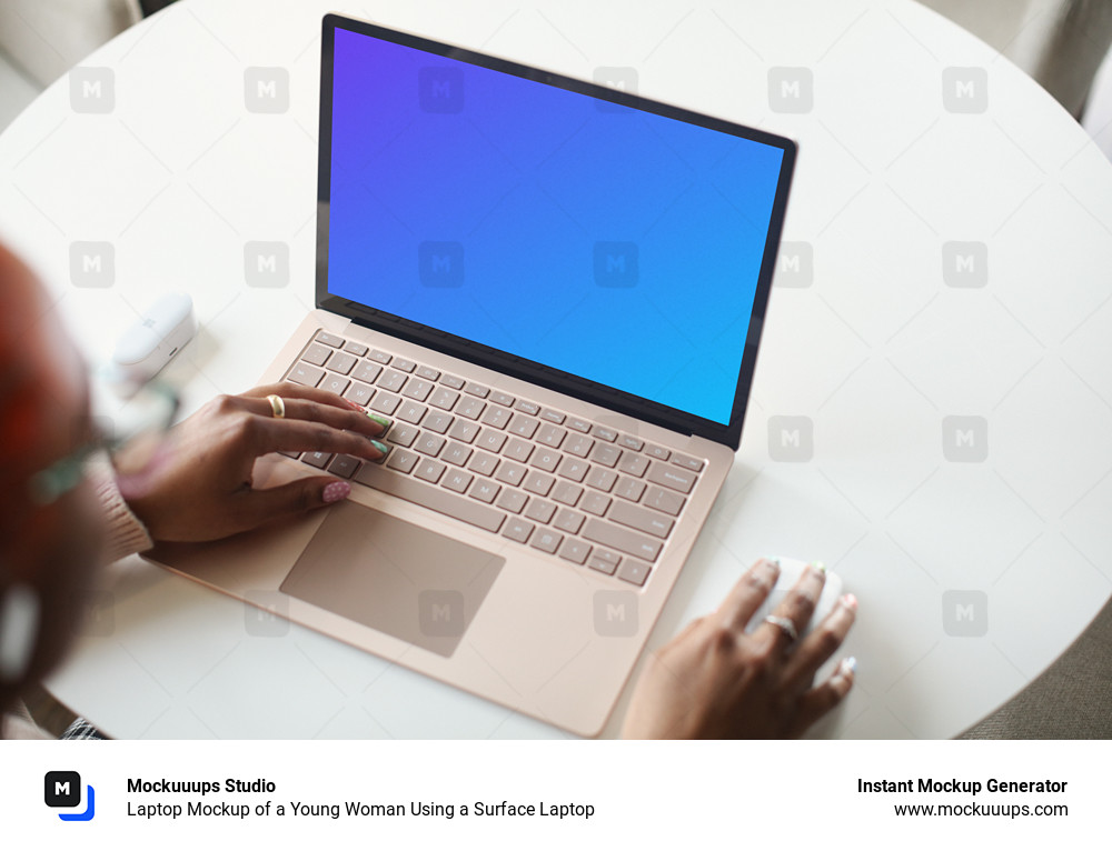 Laptop Mockup of a Young Woman Using a Surface Laptop