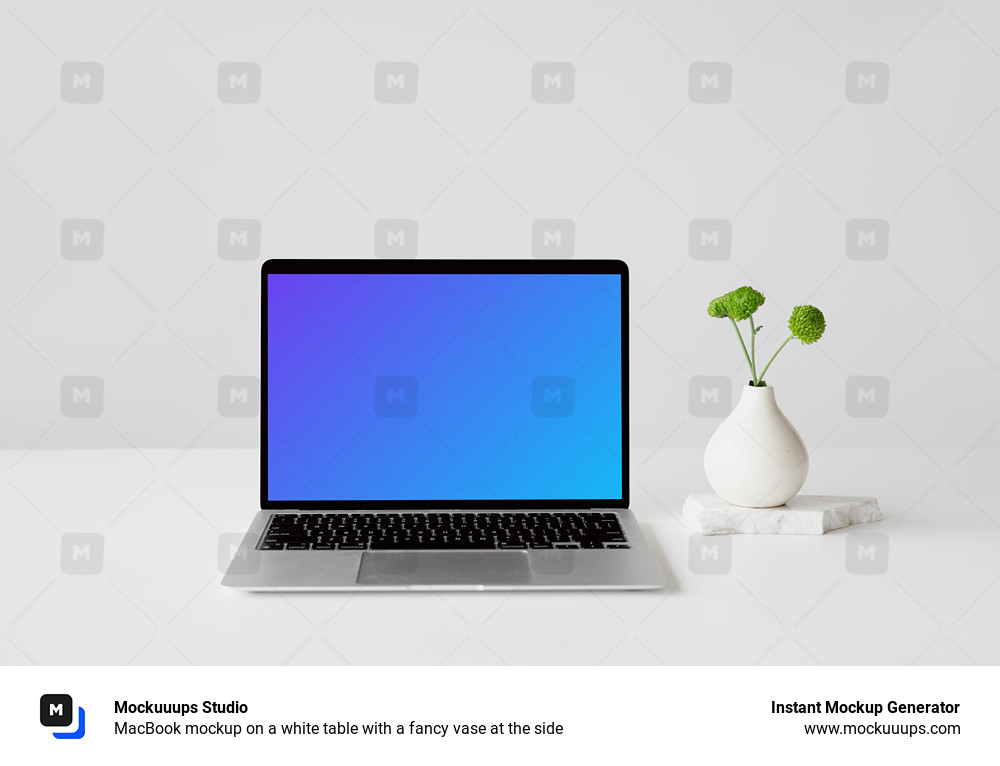MacBook mockup on a white table with a fancy vase at the side
