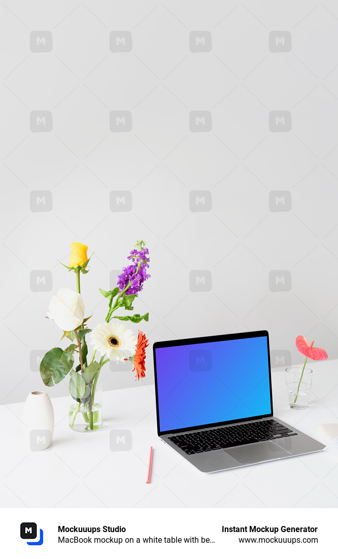 MacBook mockup on a white table with beautiful flowers in a transparent vase