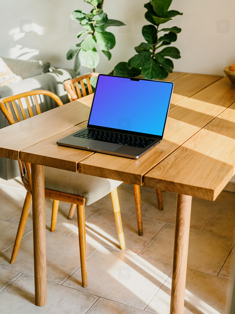 Free MacBook Pro mockup on a table
