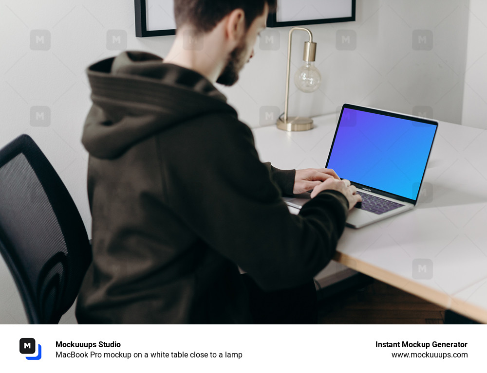 MacBook Pro mockup on a white table close to a lamp