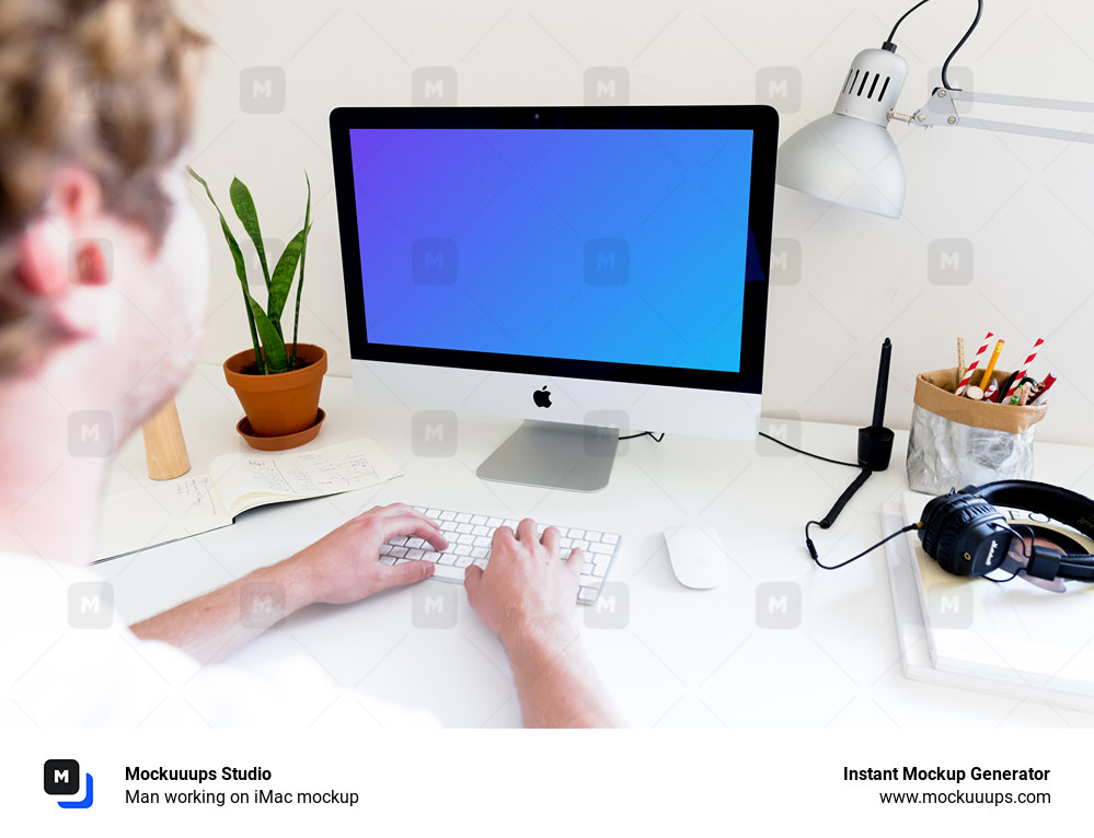 Man working on iMac mockup