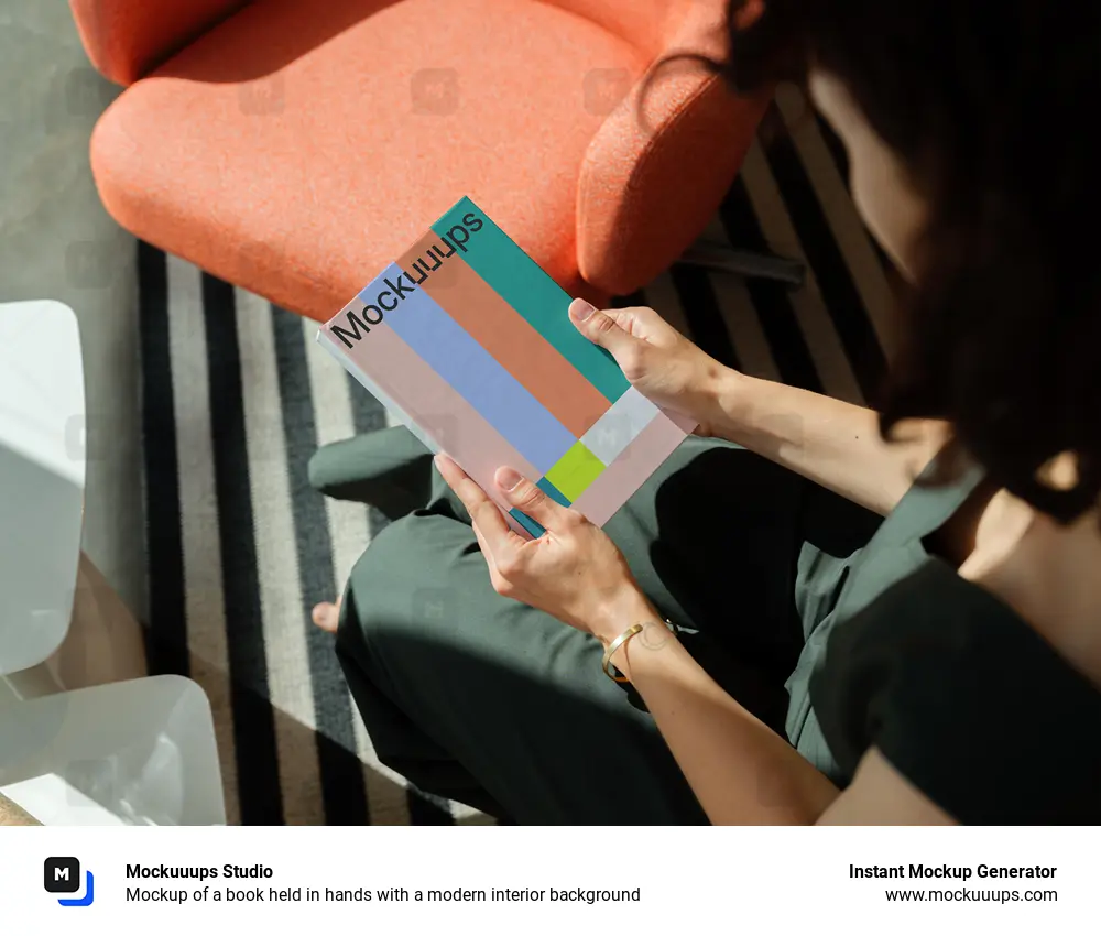 Mockup of a book held in hands with a modern interior background
