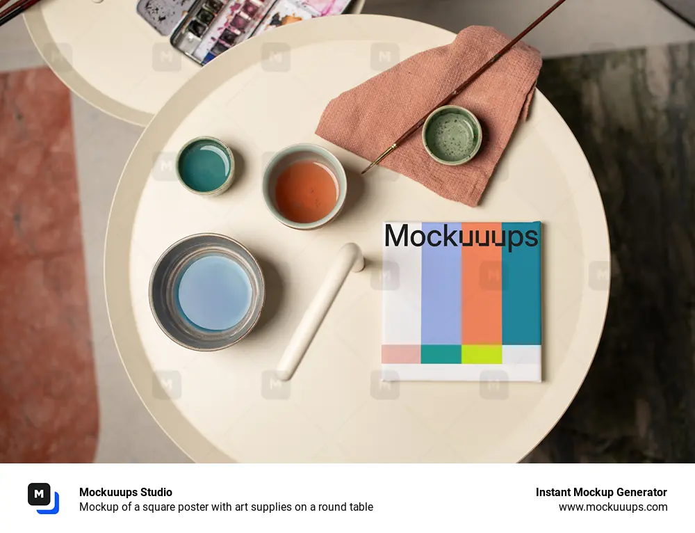 Mockup of a square poster with art supplies on a round table