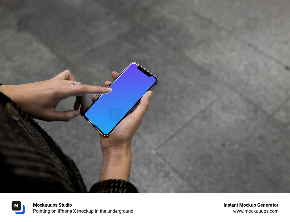 Pointing on iPhone X mockup in the underground