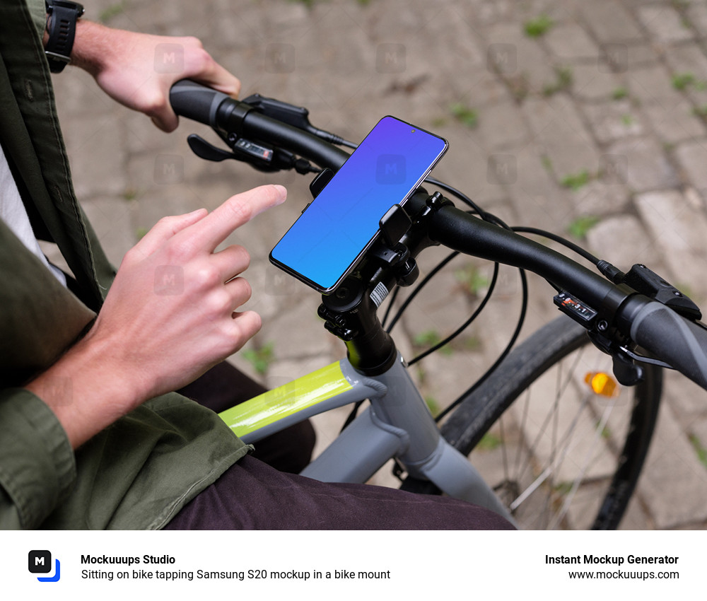 Sitting on bike tapping Samsung S20 mockup in a bike mount