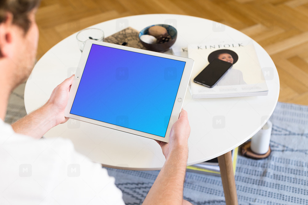 Sitting on couch with iPad Pro Mockup