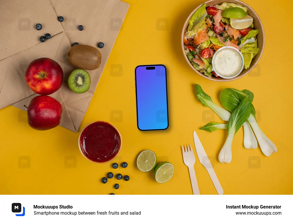 Smartphone mockup between fresh fruits and salad