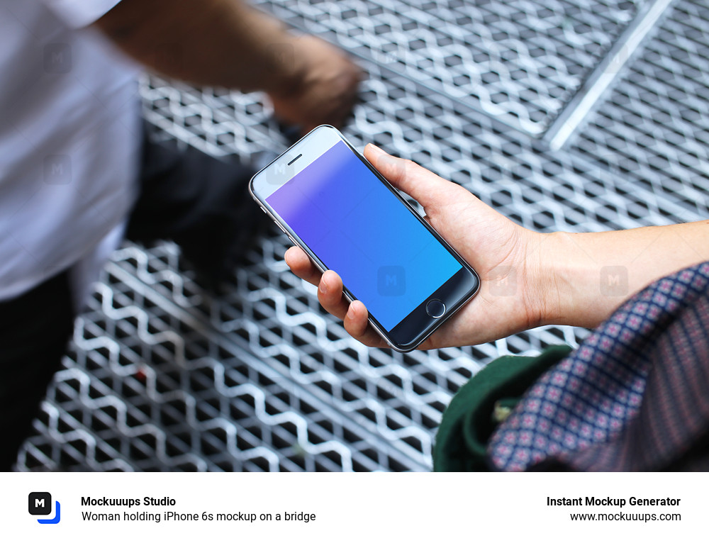 Woman holding iPhone 6s mockup on a bridge