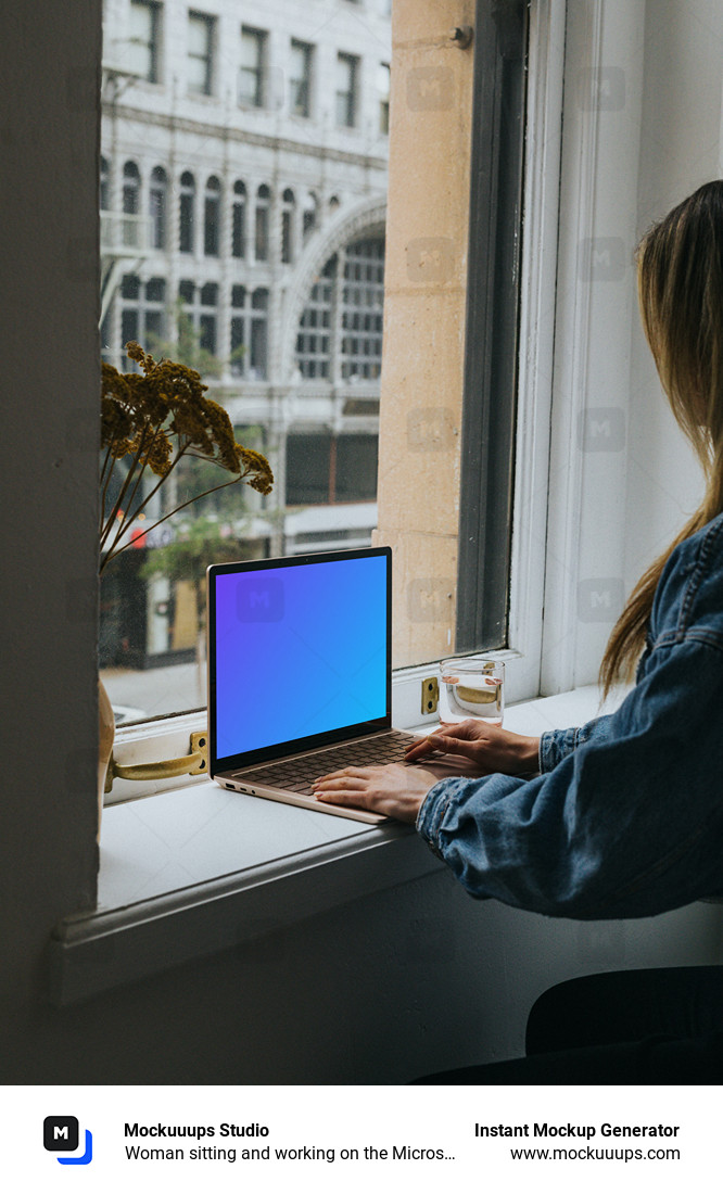 Woman sitting and working on the Microsoft Surface Laptop mockup