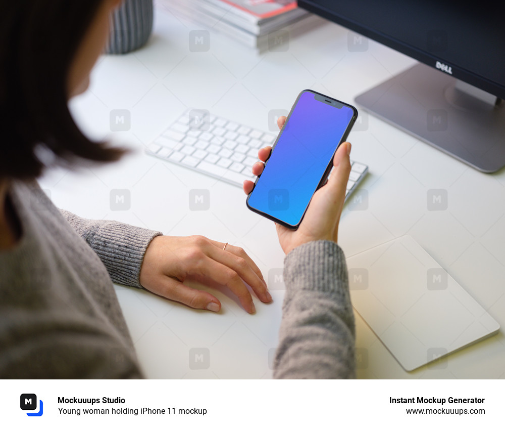 Young woman holding iPhone 11 mockup