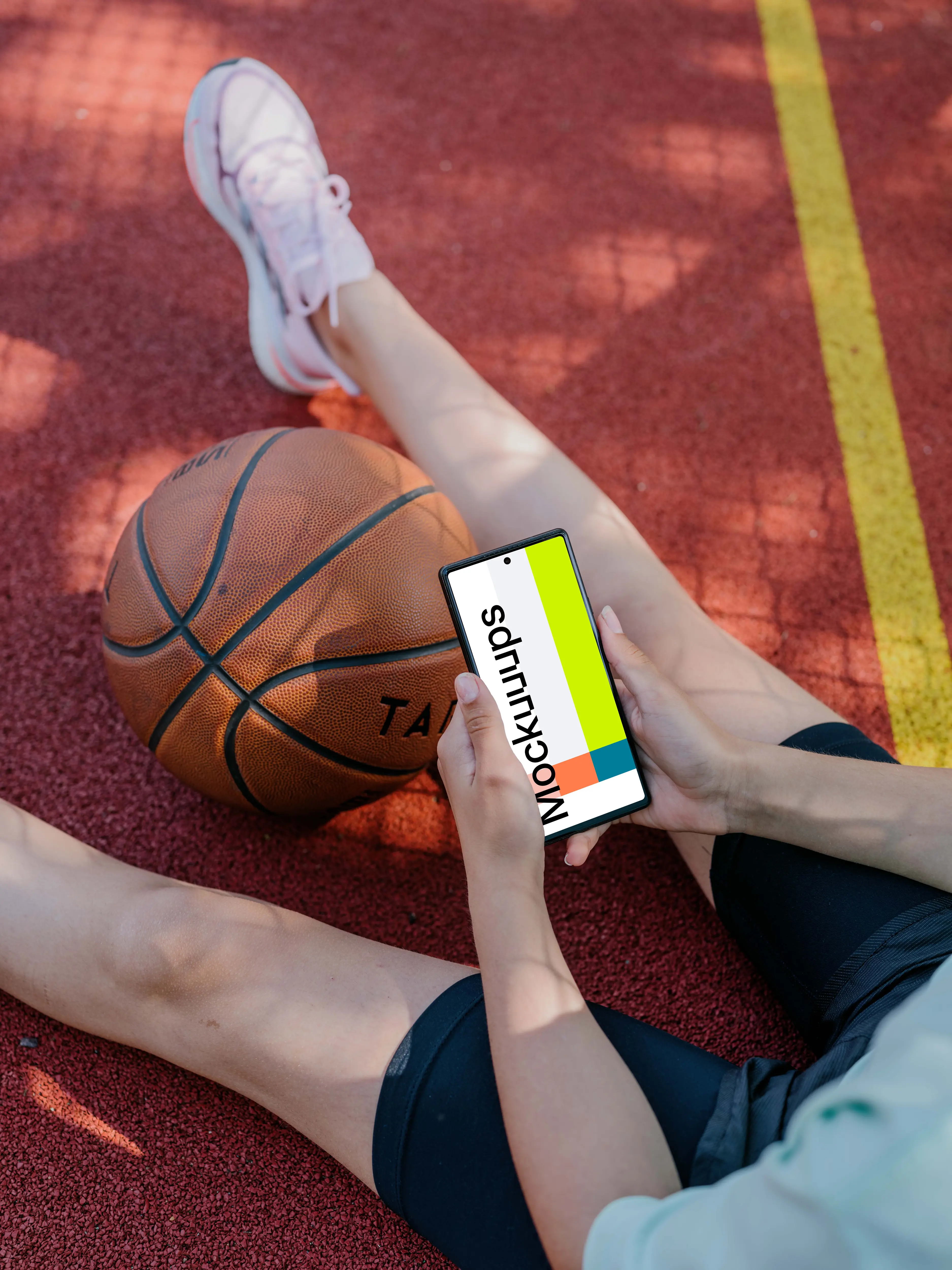 Basketball player checking on a Google Pixel mockup