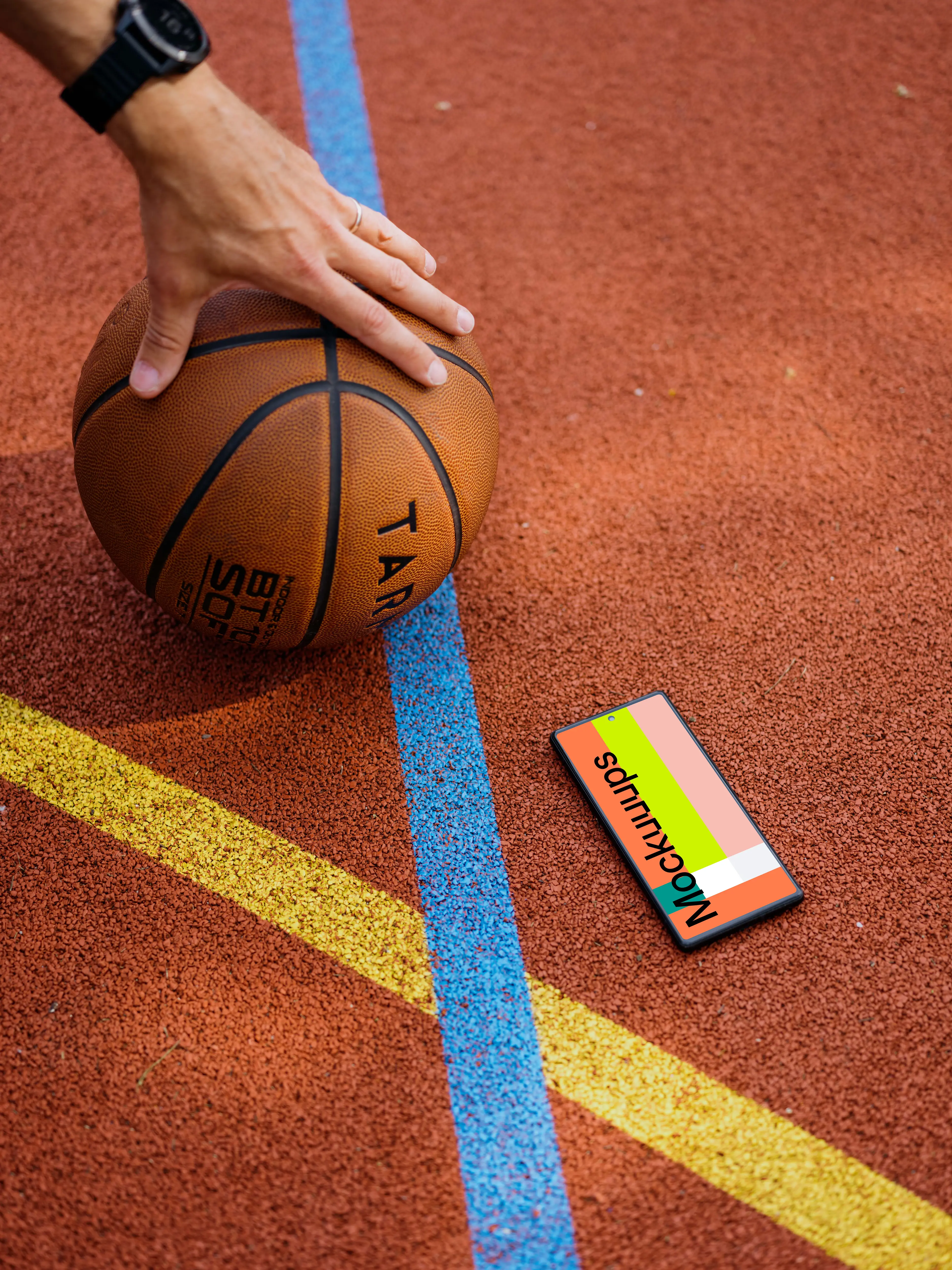 Basketball player standing next to a Google Pixel 6 mockup