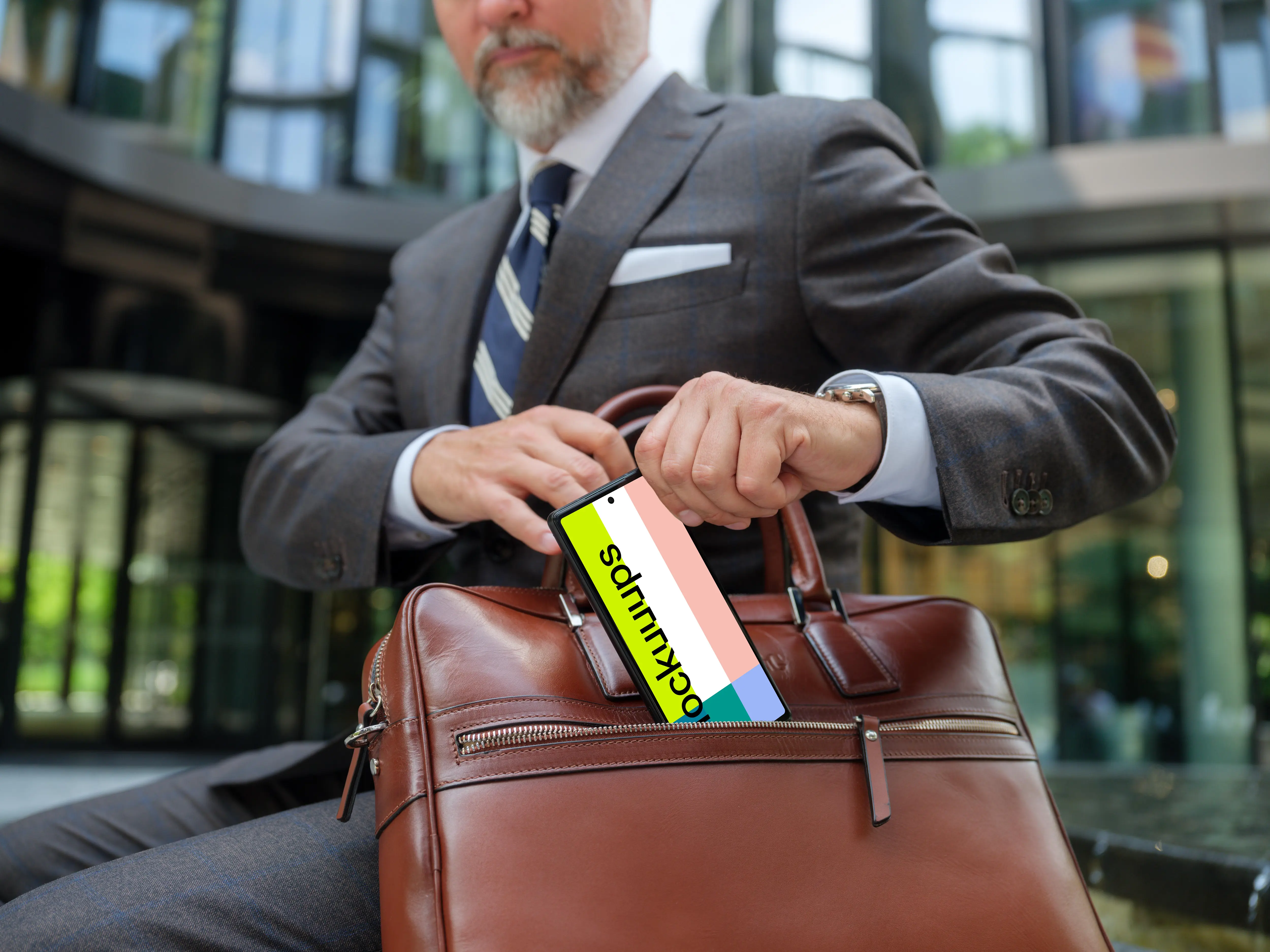 Businessman holding a Google Pixel mockup