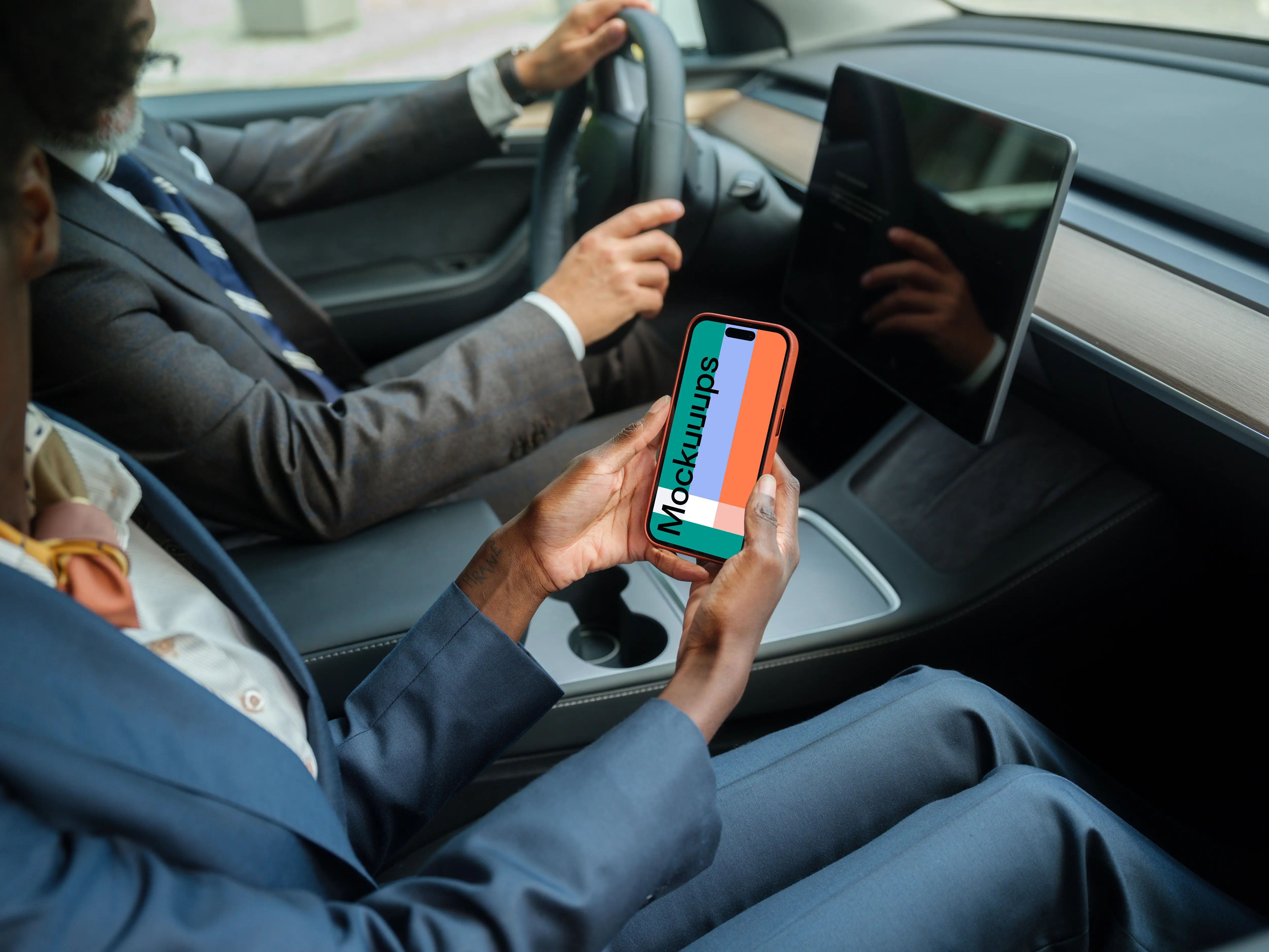 Businesspeople in Tesla with iPhone mockup