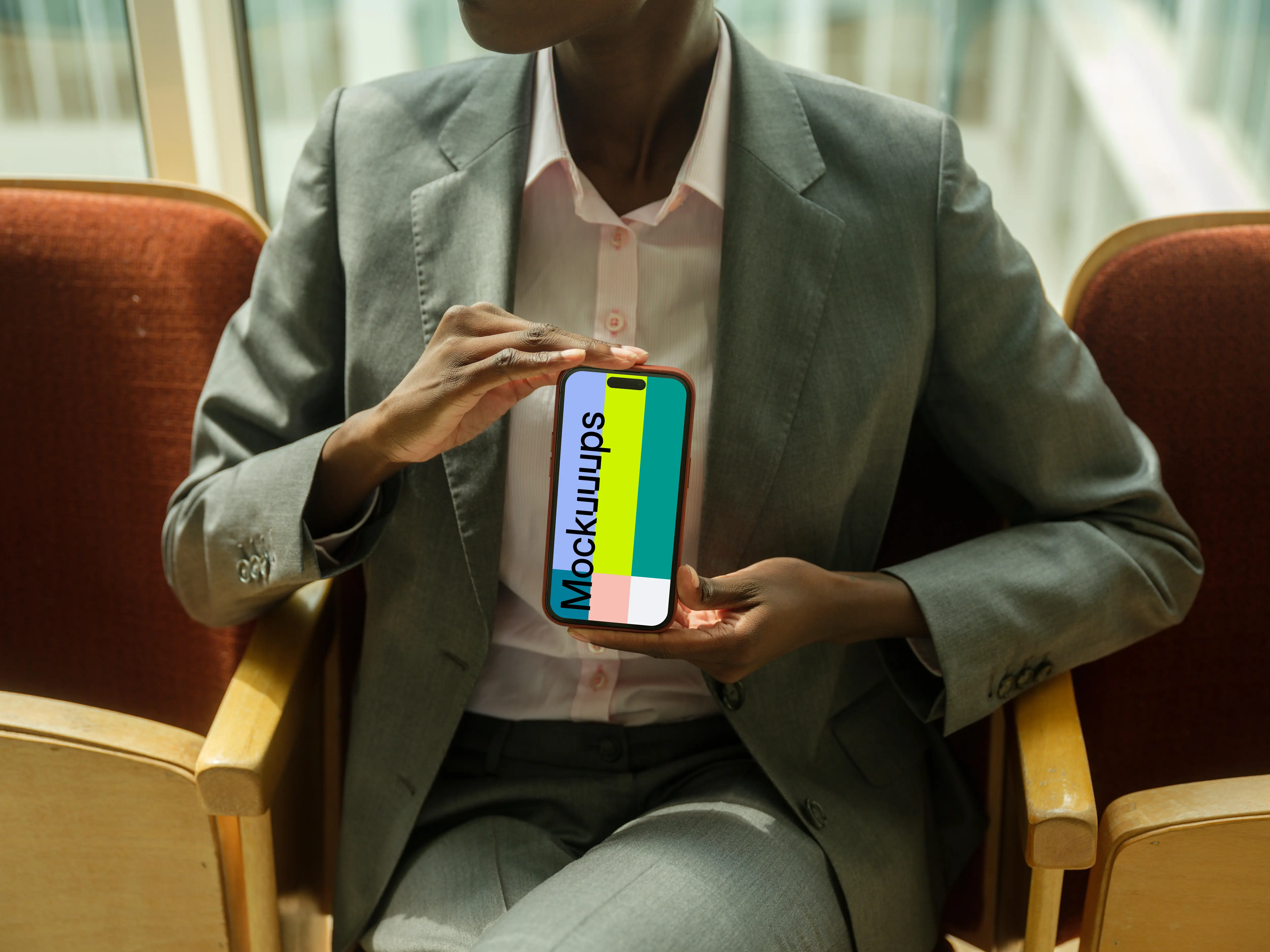 Businesswoman holding an iPhone mockup