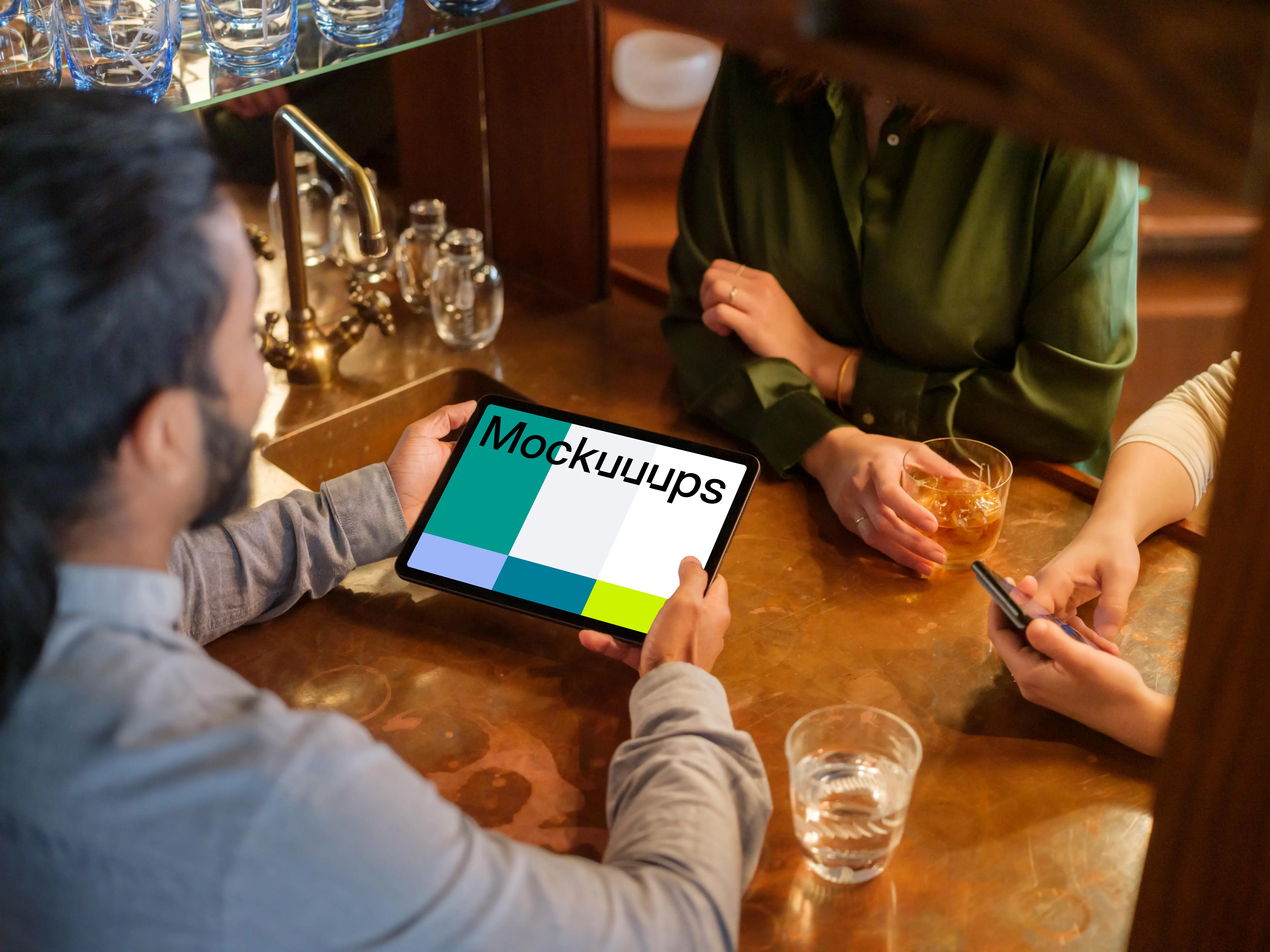 Colleagues in the lounge with iPad mockup