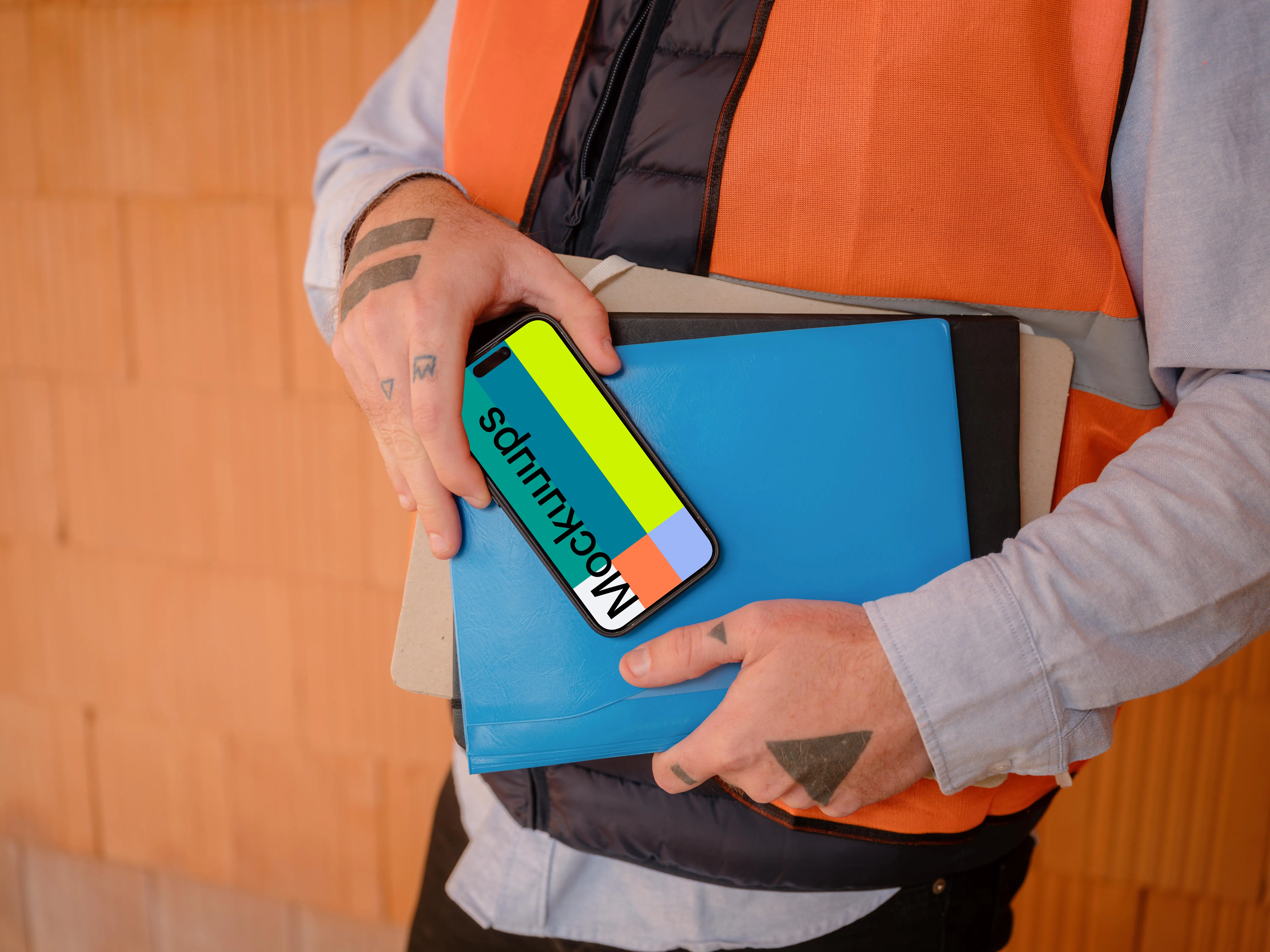 Construction worker presenting an iPhone 15 Pro mockup