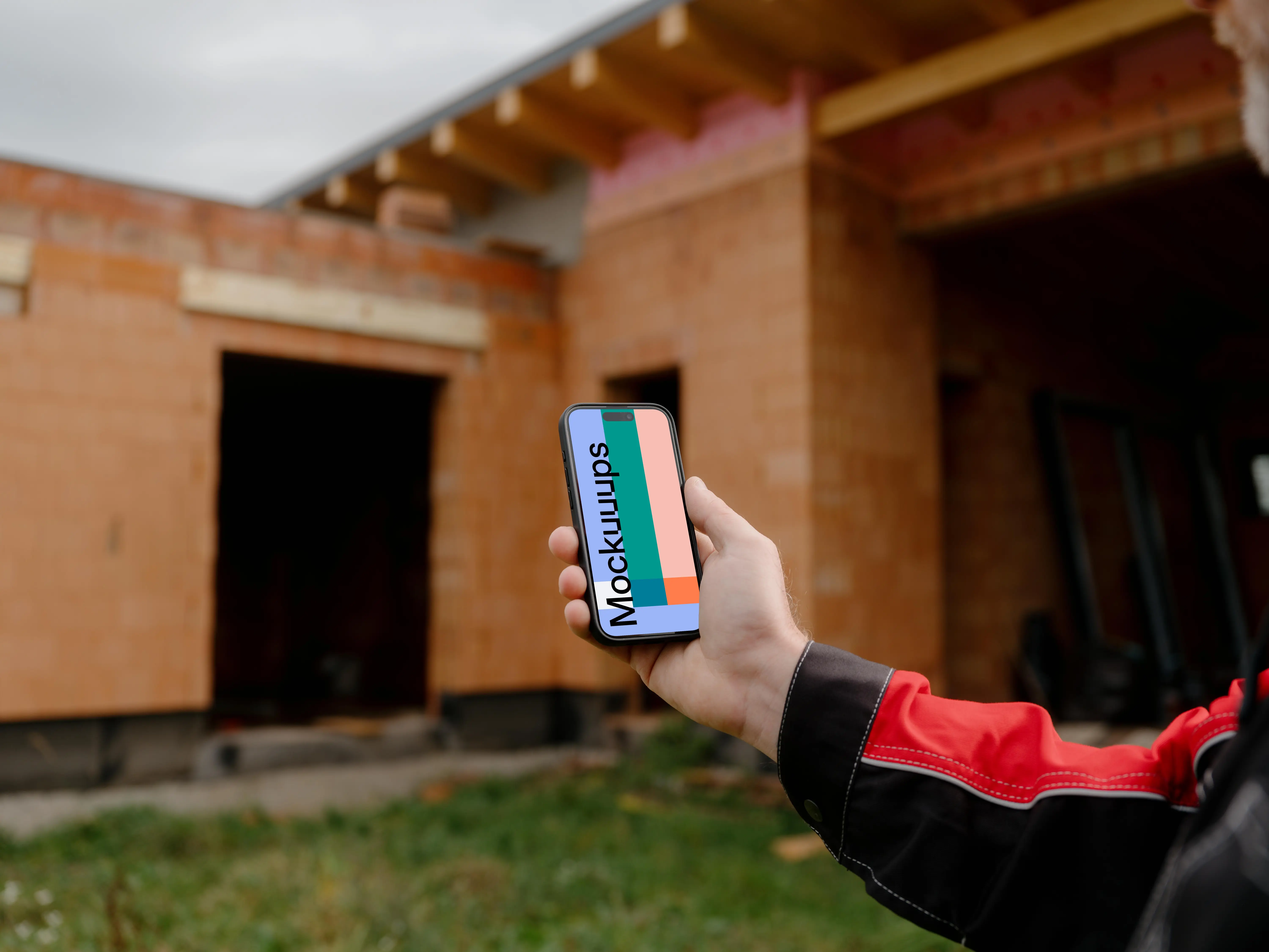 Construction worker with an iPhone 15 Pro mockup