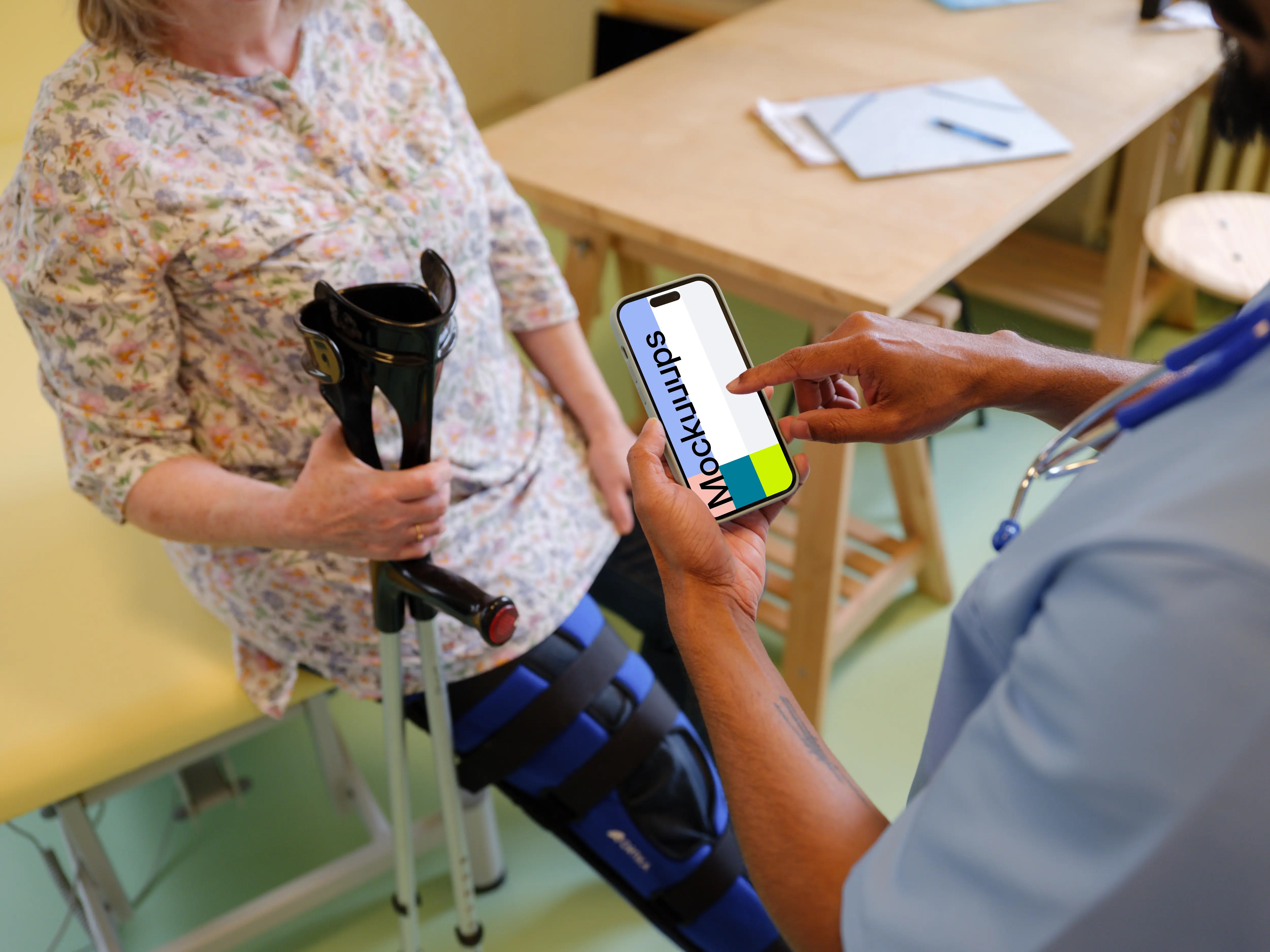 Doctor typing on an iPhone