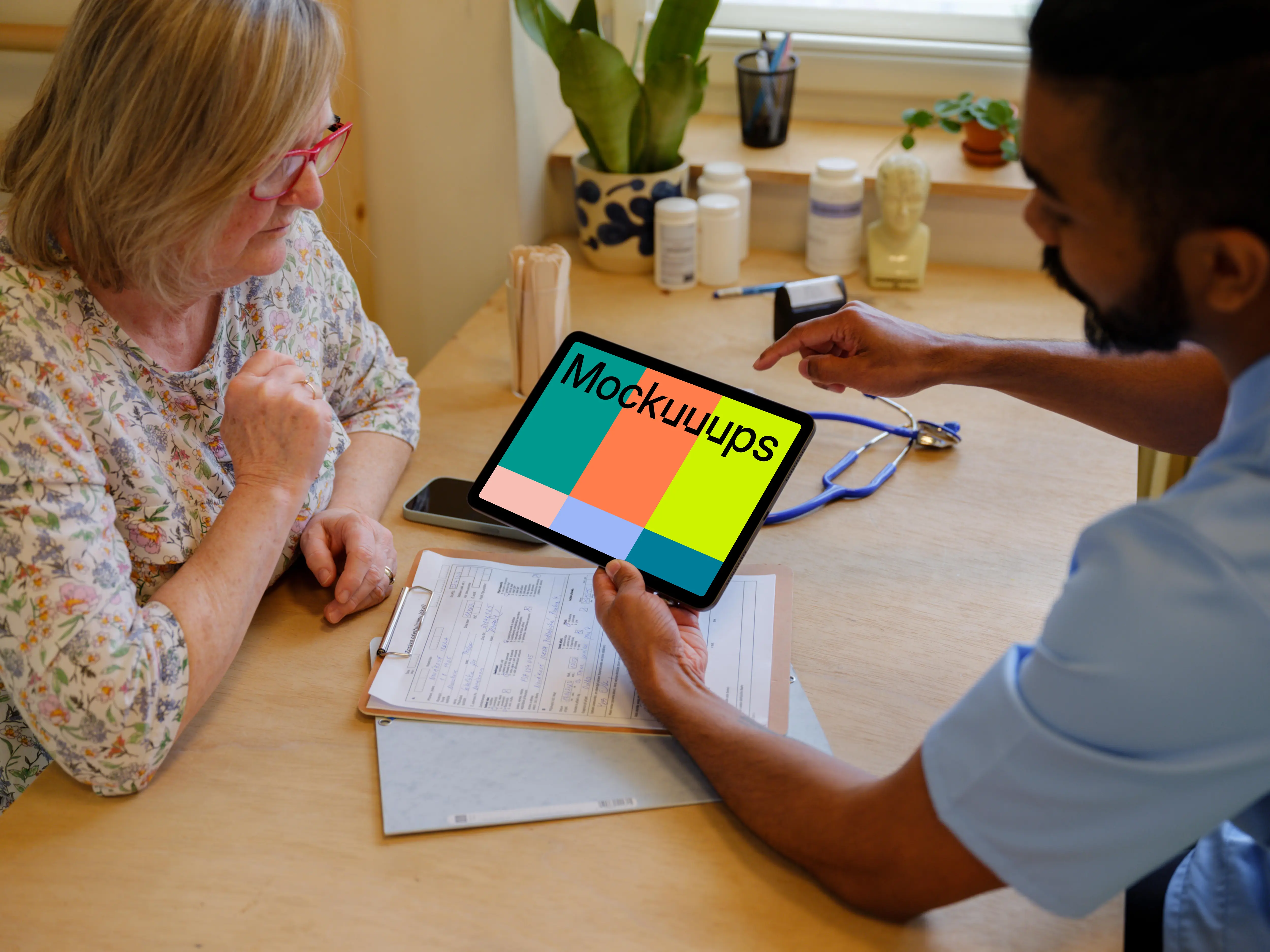 Doctor’s hand holding an iPad mockup