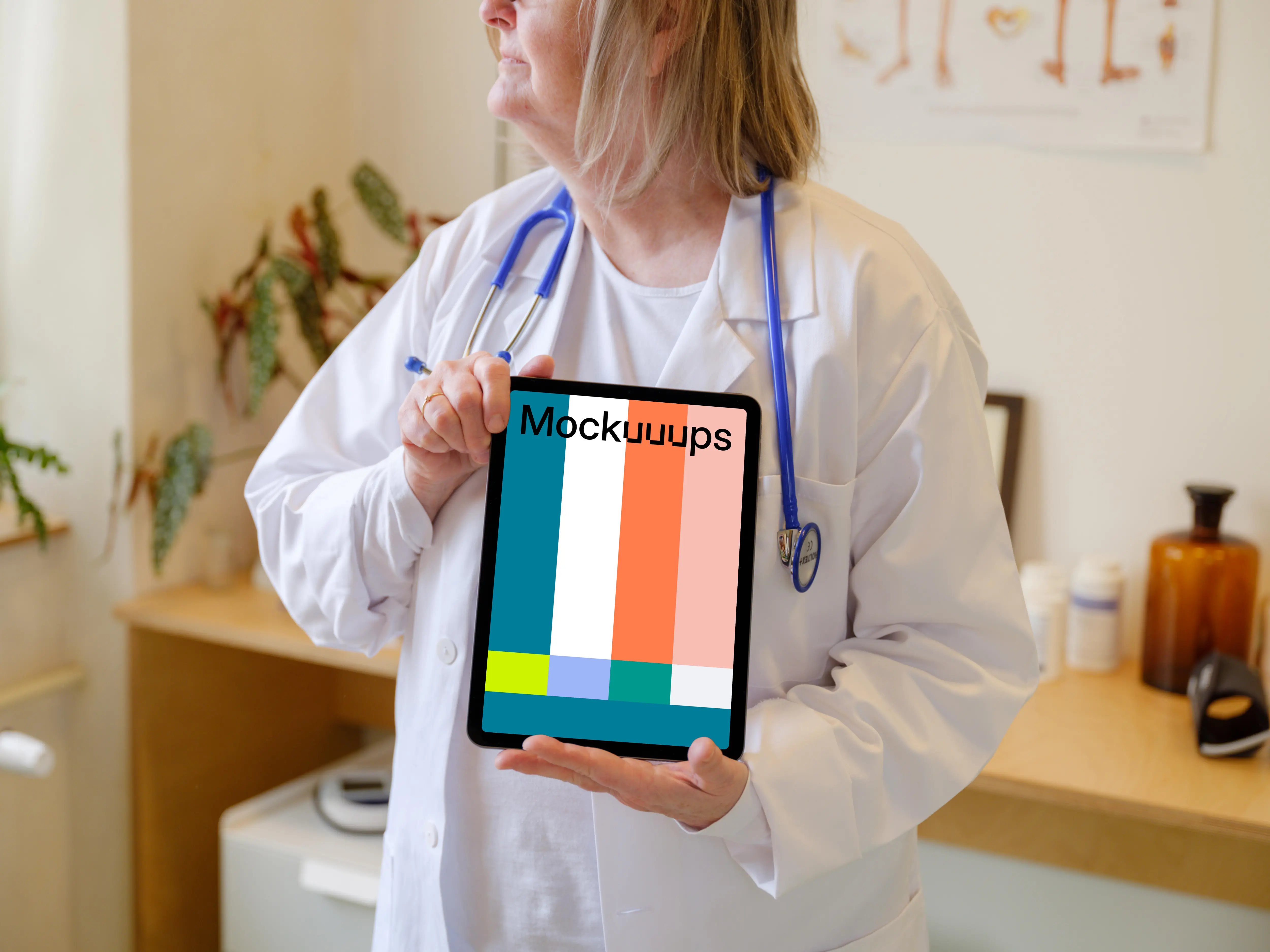 Female doctor holding an iPad Air mockup