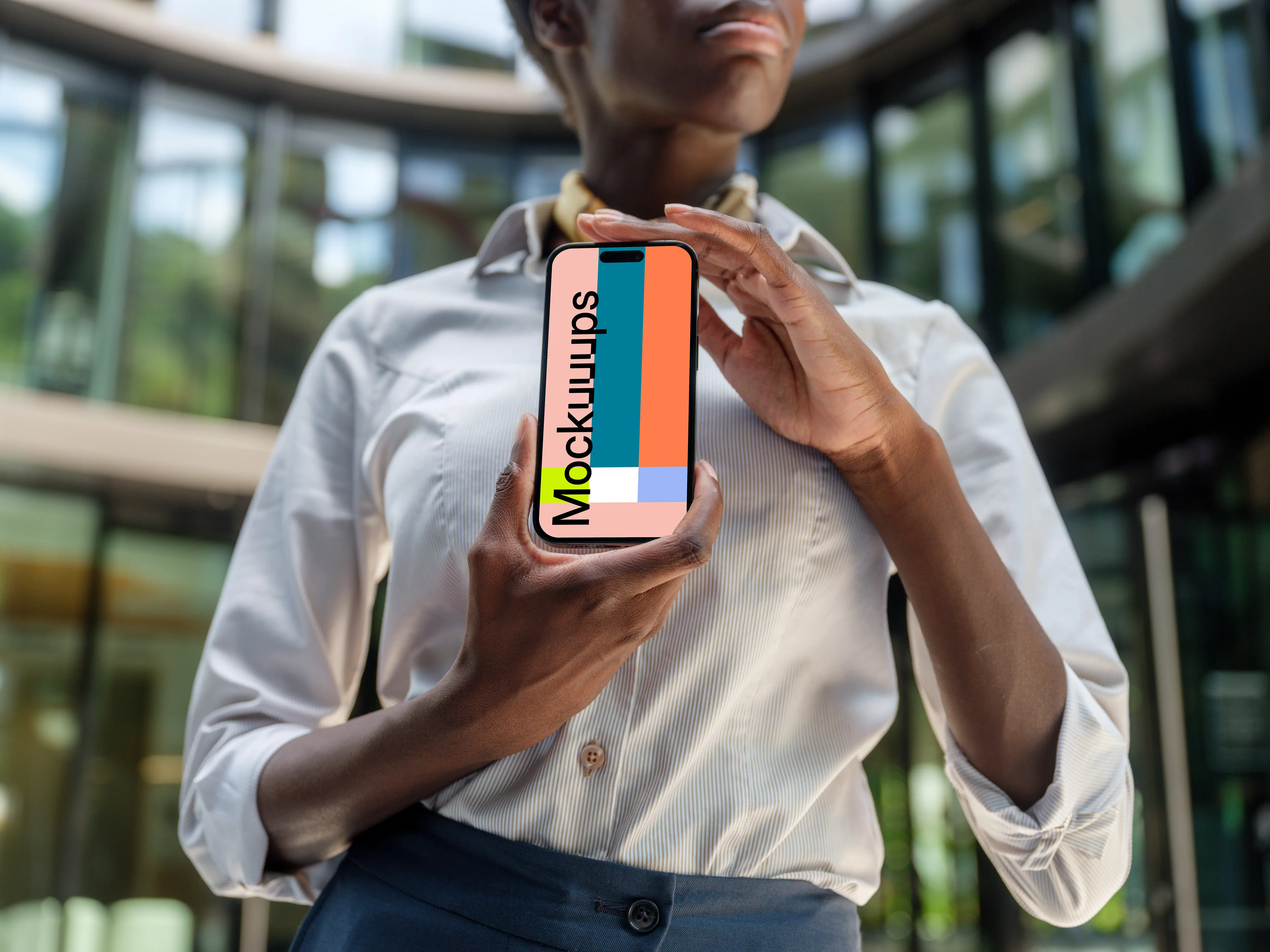 Female entrepreneur holding an iPhone 14 Pro mockup