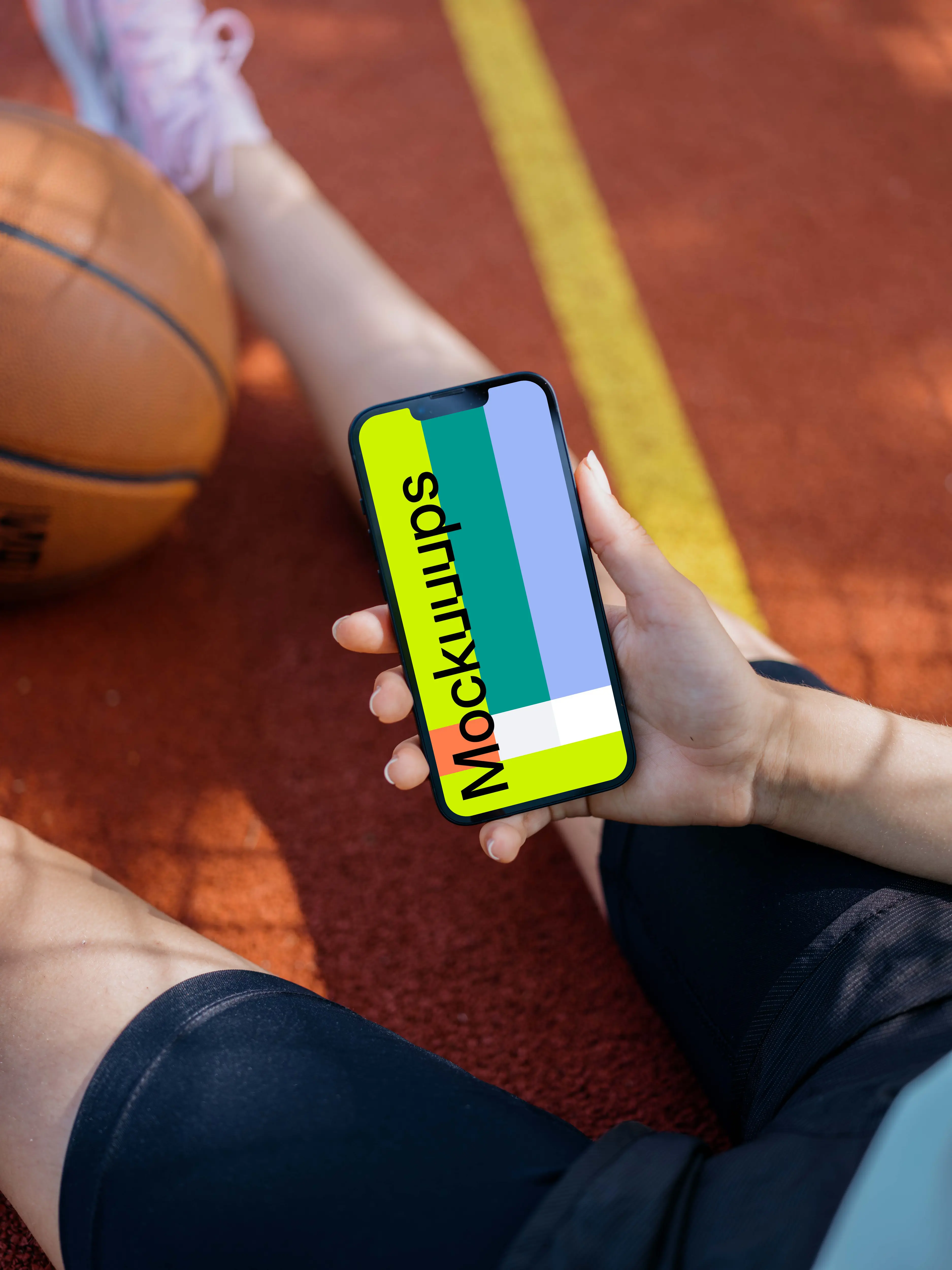 Female hand holding an iPhone 13 mockup