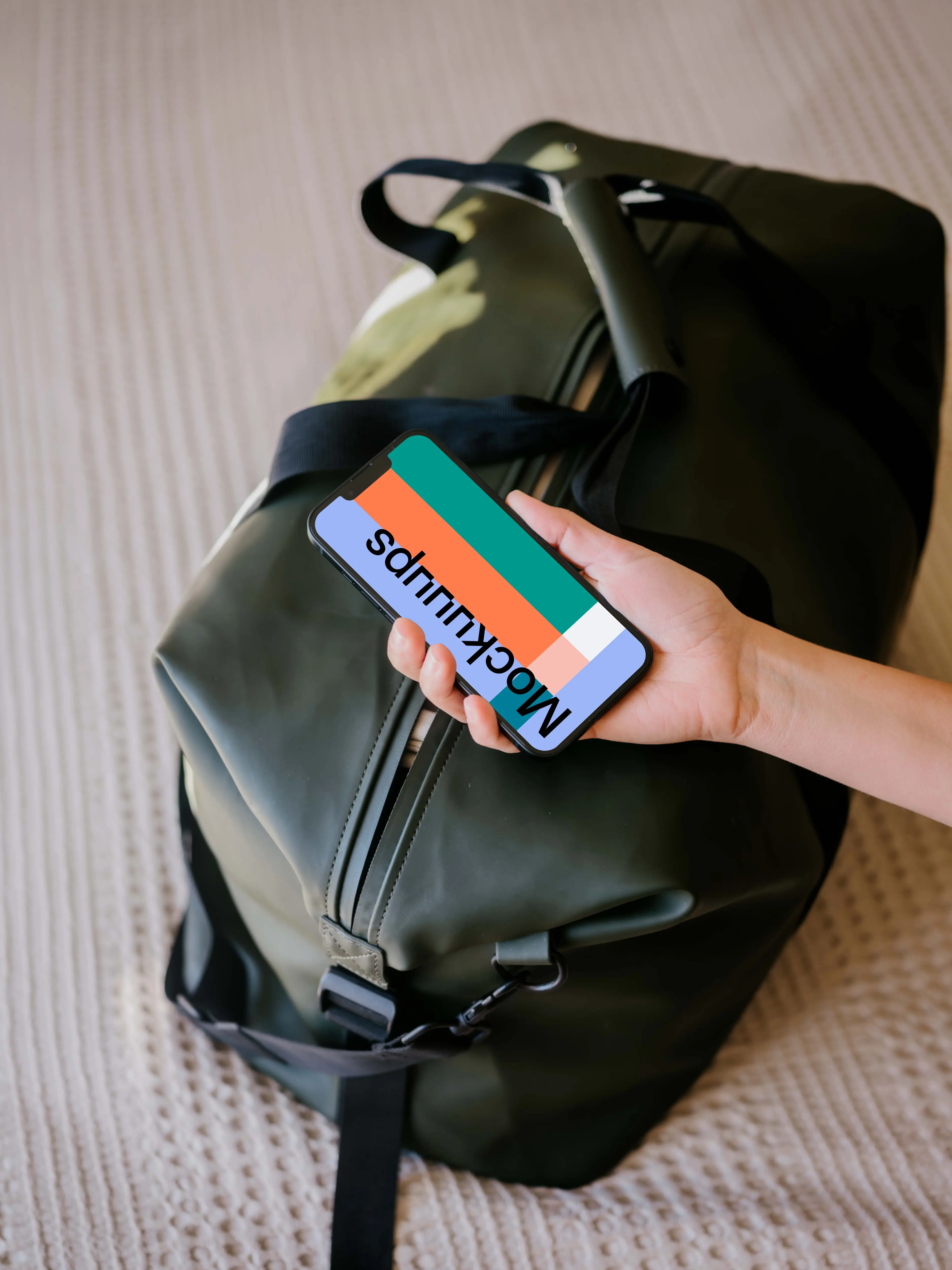 Female hand holding an iPhone mockup