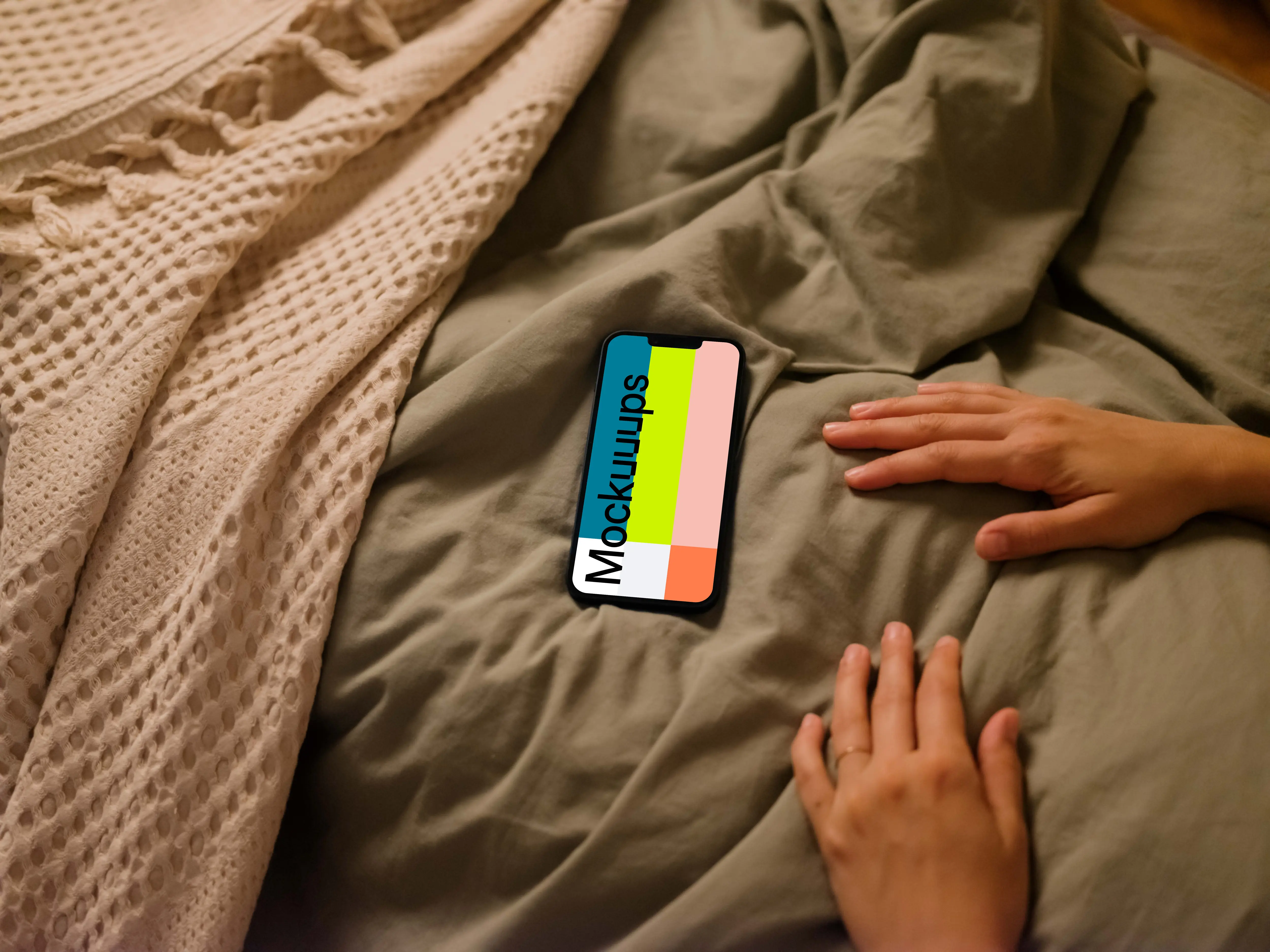 Female hands next to an iPhone 13 mockup