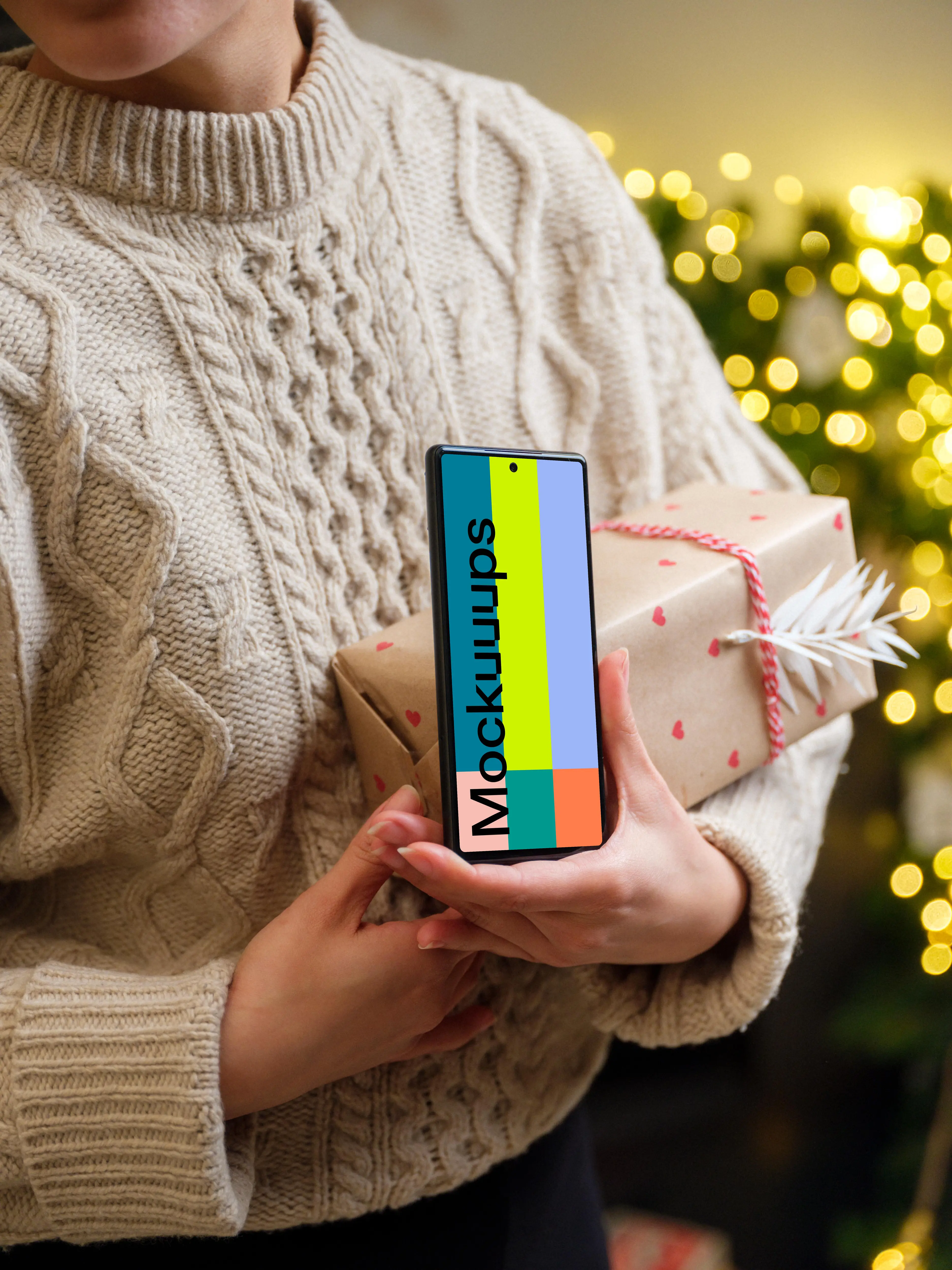 Female holding a Google Pixel and Christmas present mockup