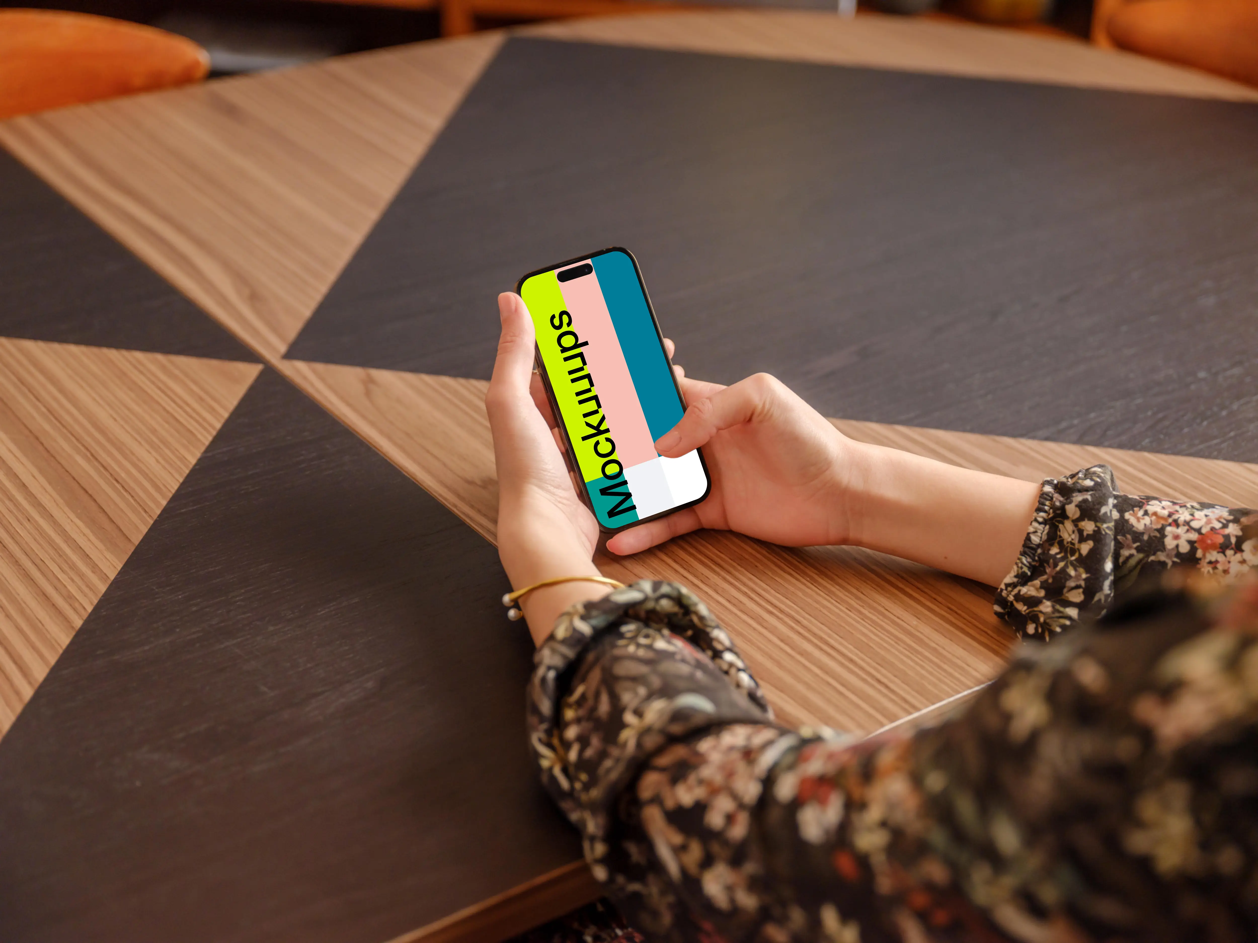 Female holding a iPhone mockup in the office