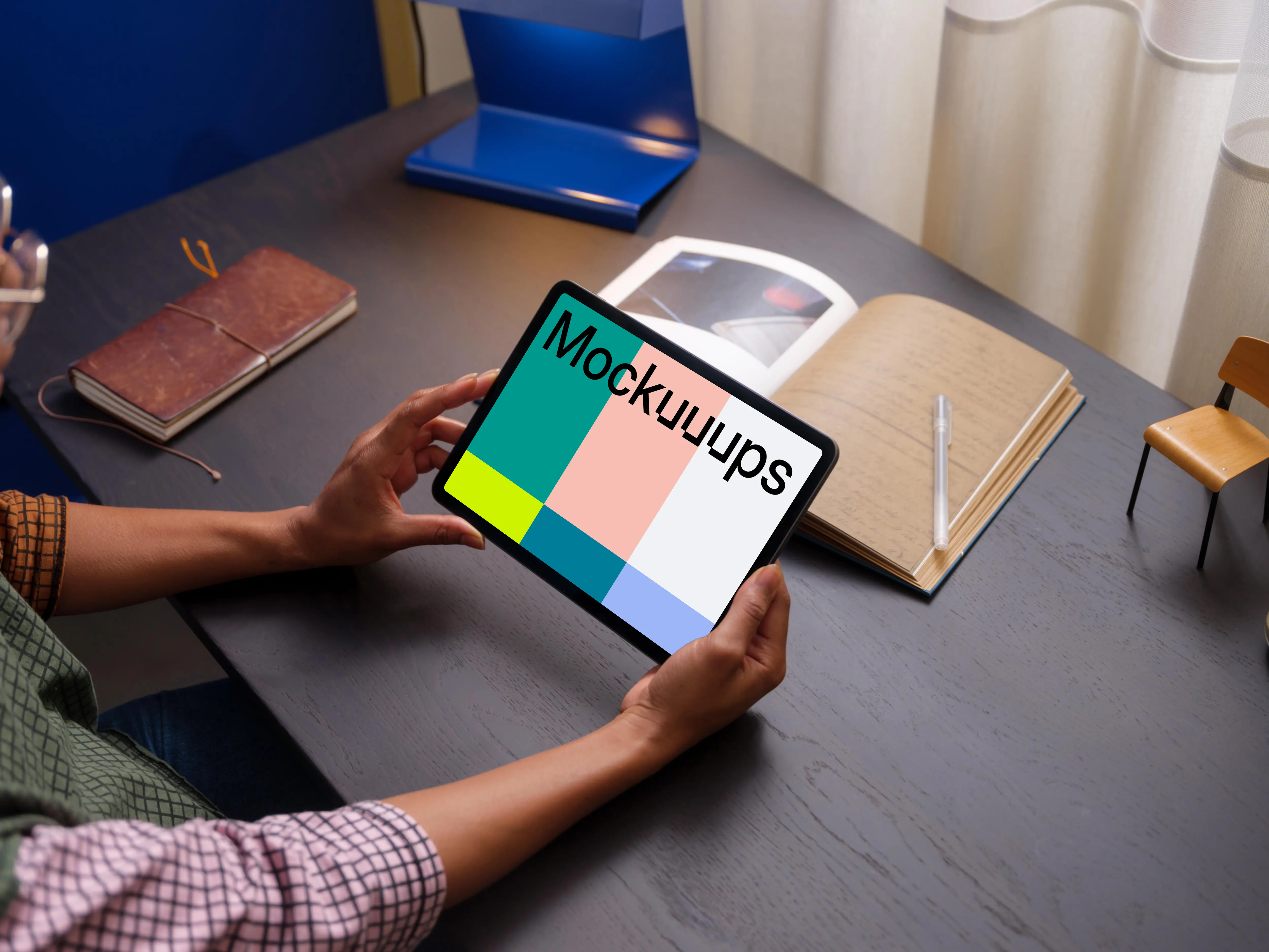 Female holding an iPad Air mockup