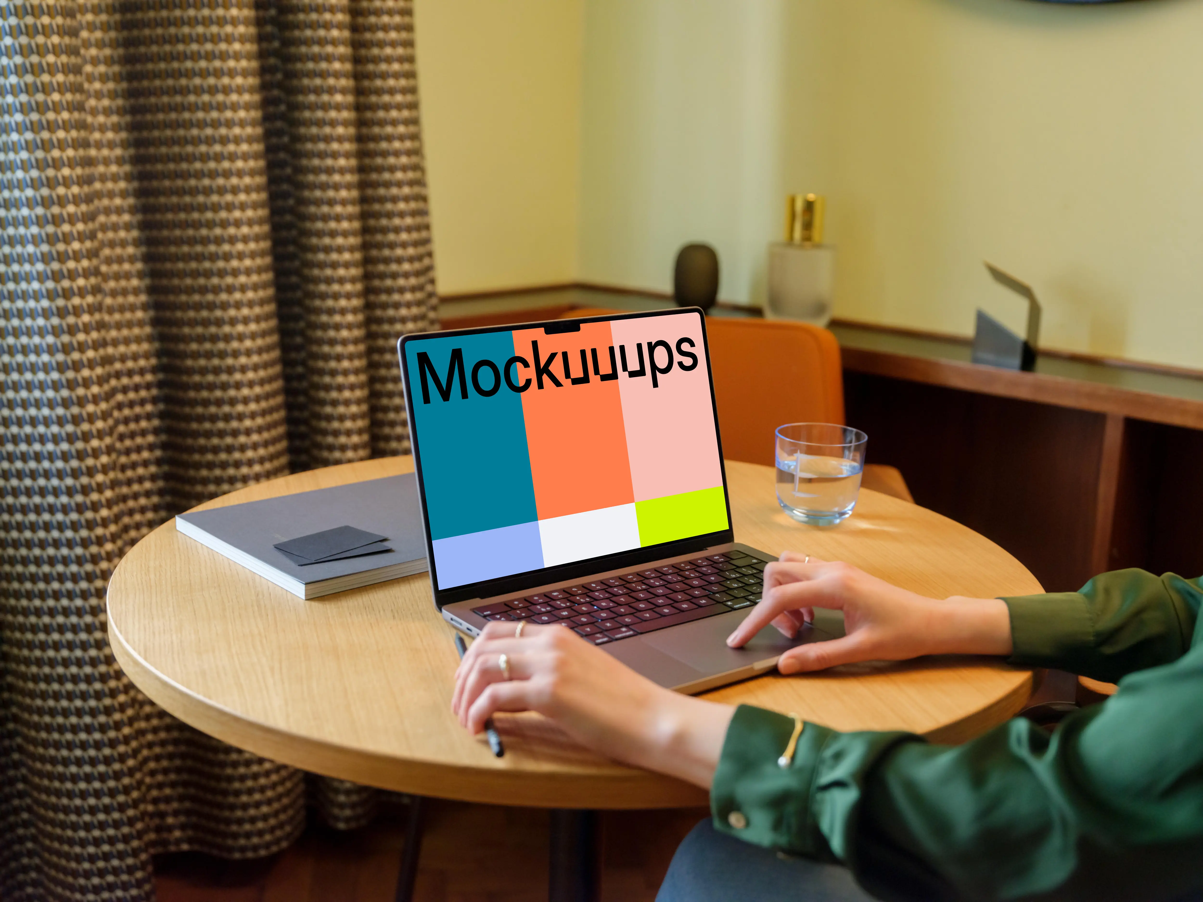 Female in the office working on a MacBook mockup