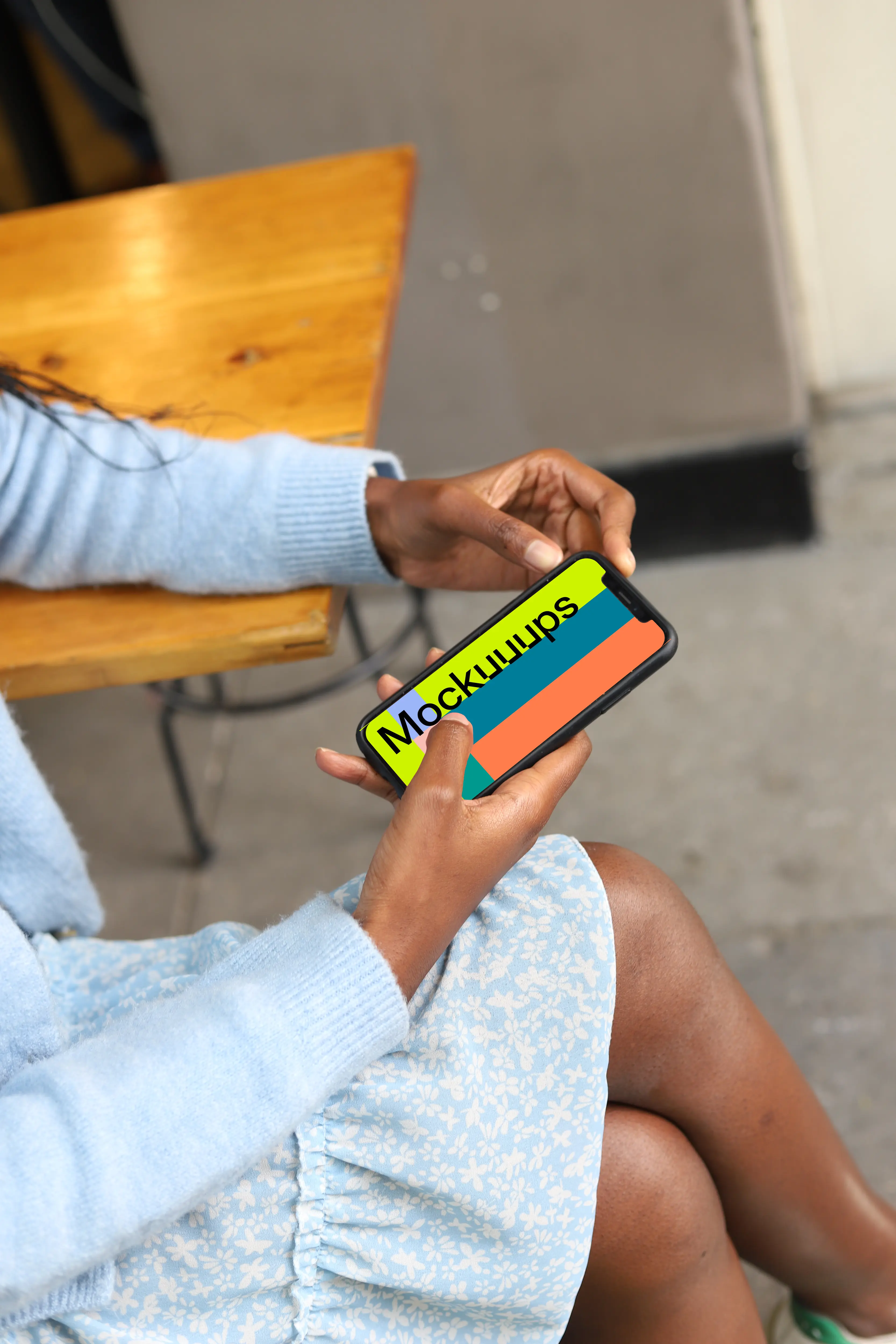 Female pointing on iPhone 12 mockup