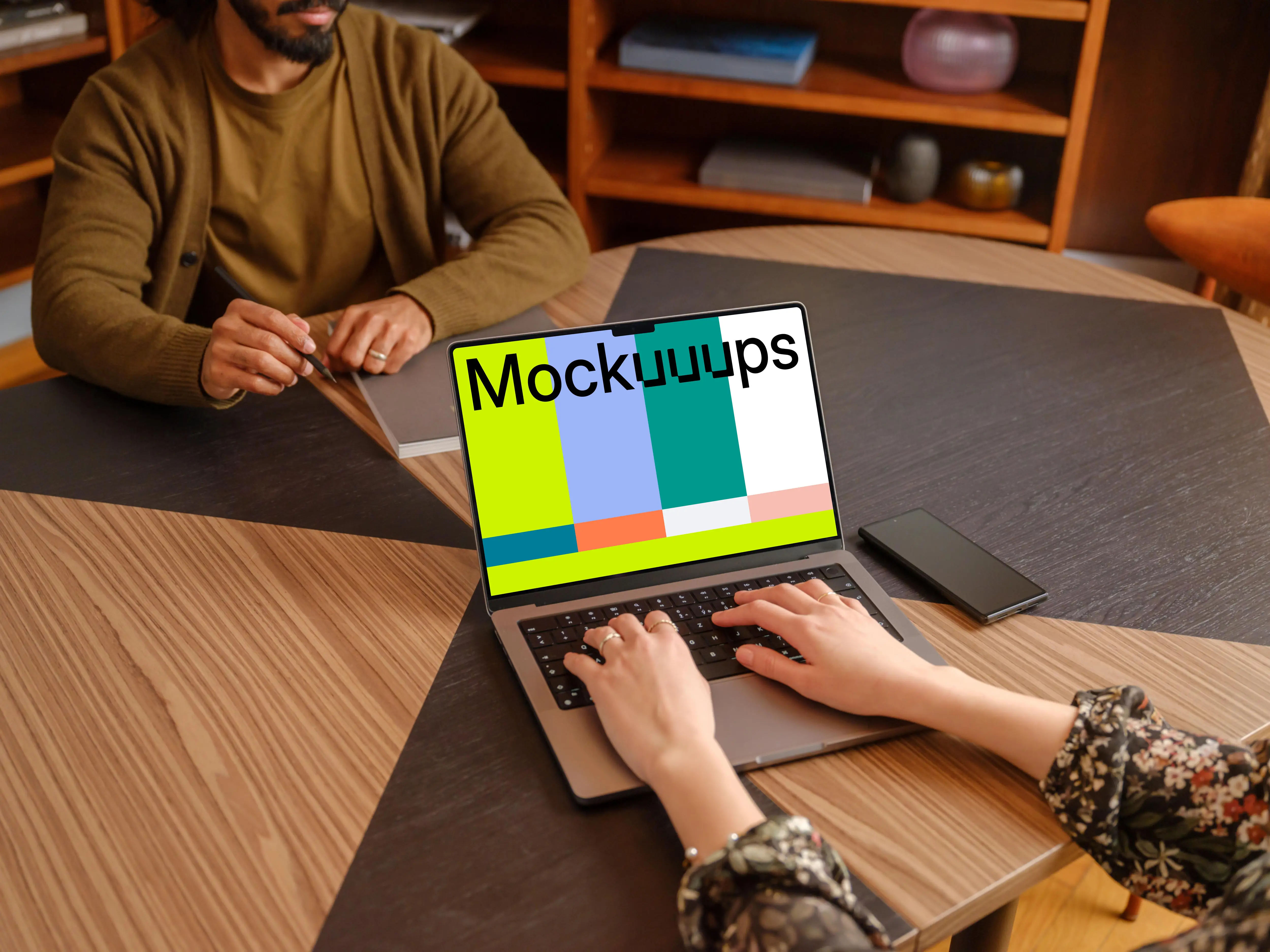 Female typing on a MacBook Pro mockup in the office