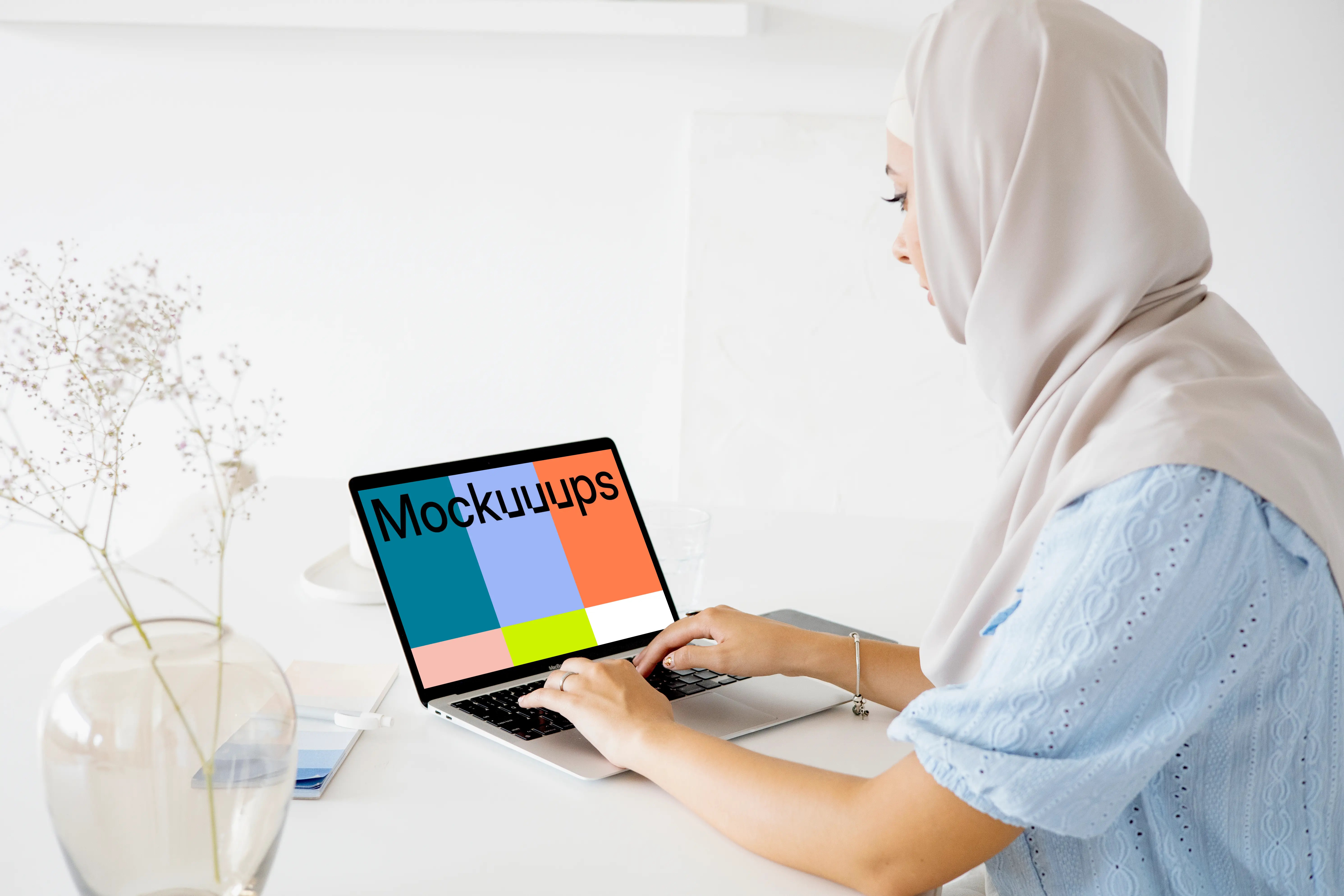 Female user typing on a Laptop mockup