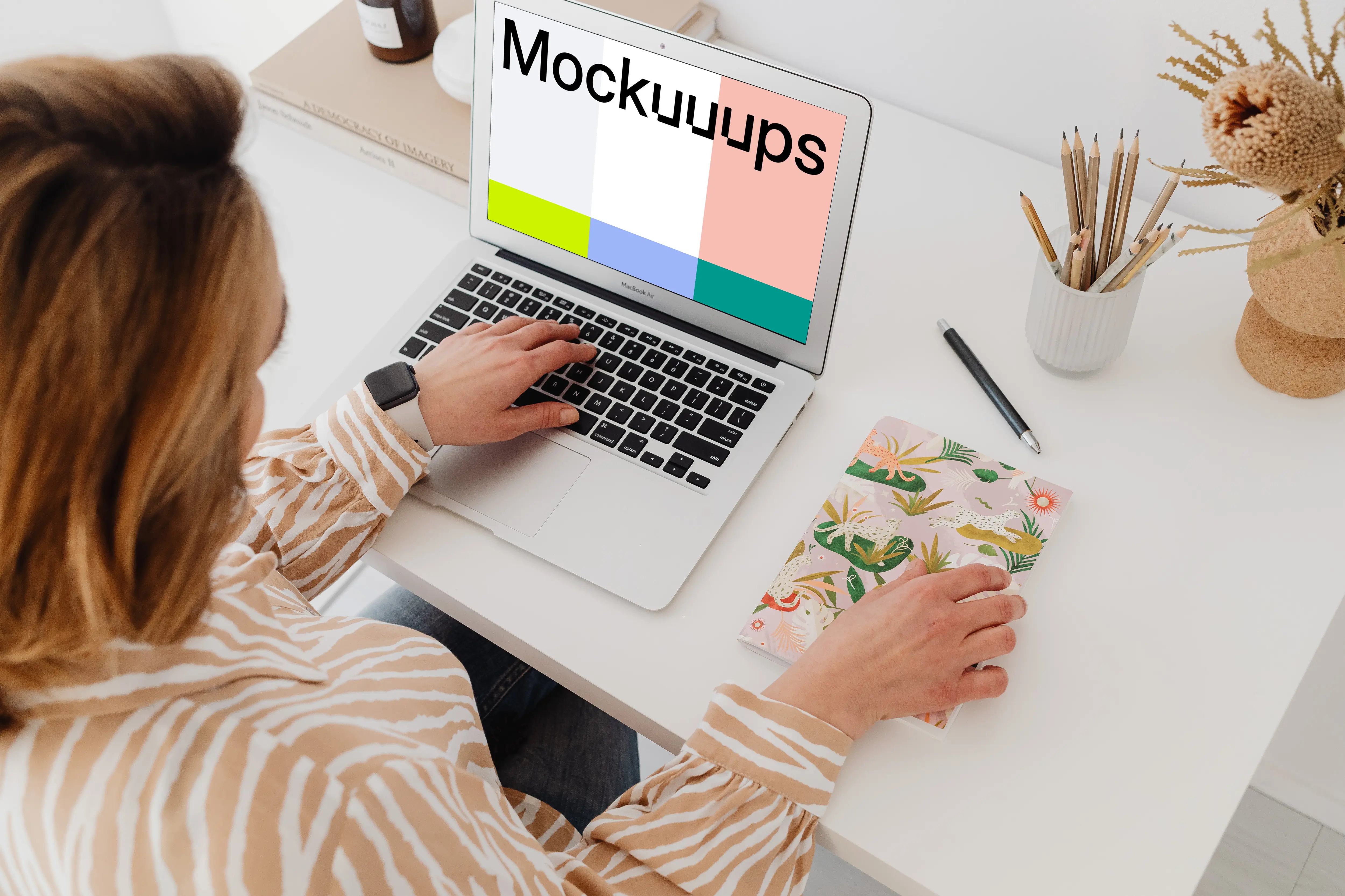 Female working on a MacBook Air mockup