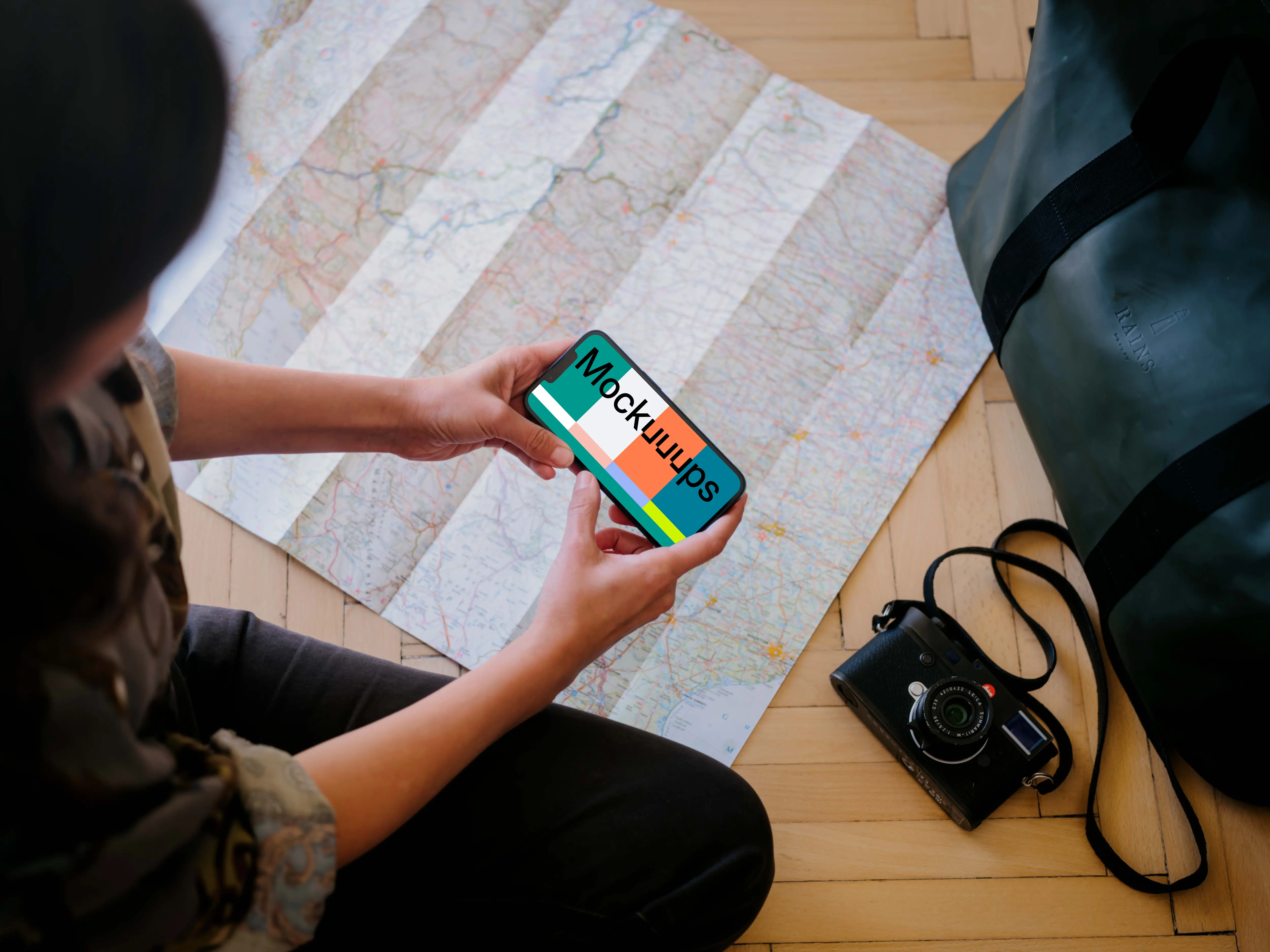 Female working on an iPhone 13 mockup