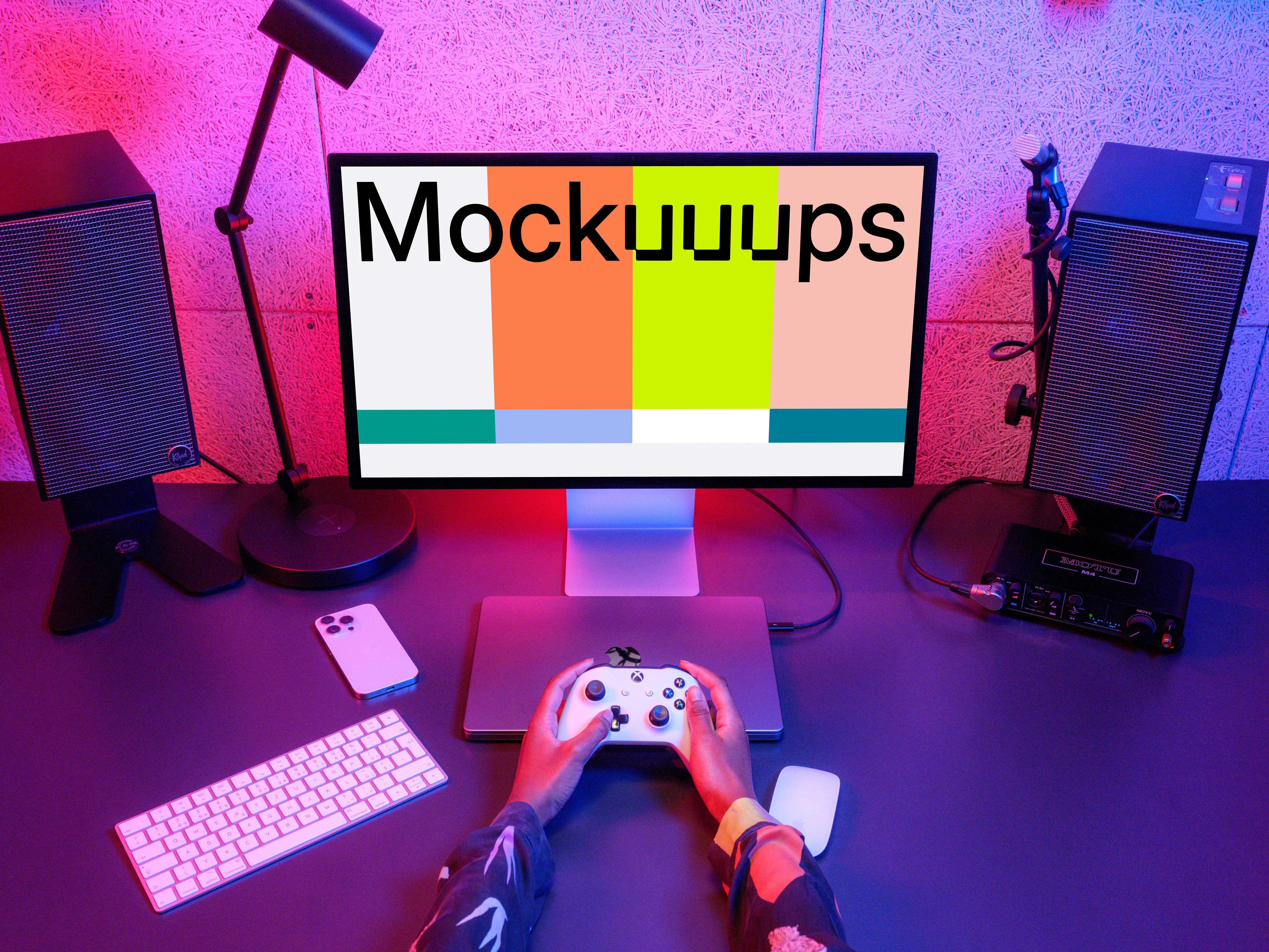 Gamer's desk with Apple Studio Display mockup and peripherals